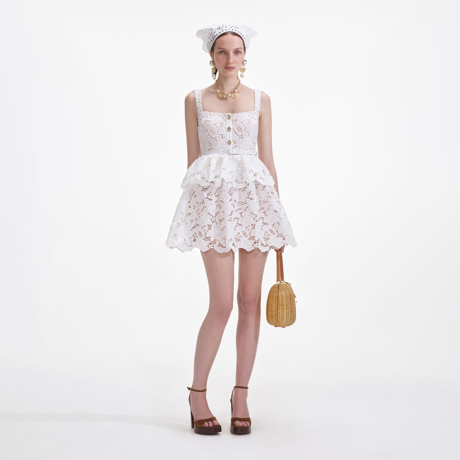 Front view of a woman wearing the White Lace Tiered Mini Dress