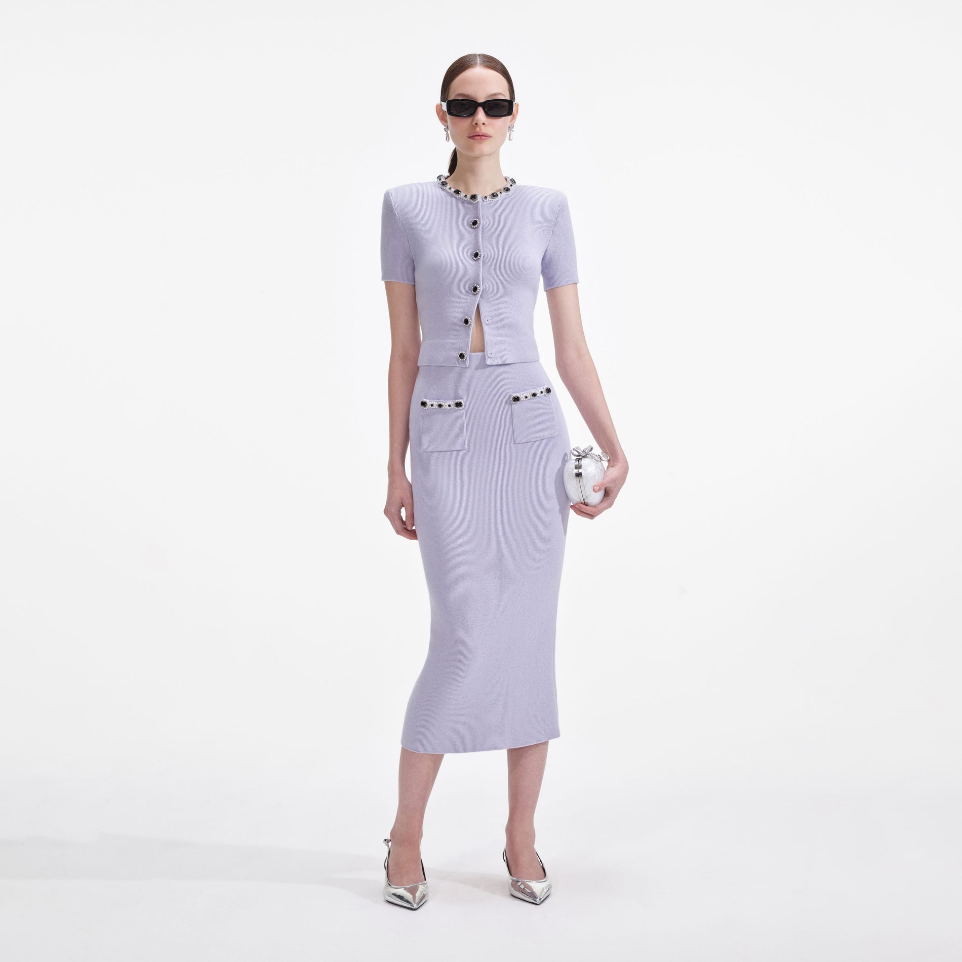 Front view of a woman wearing the Lilac Embellished Knit Midi Skirt