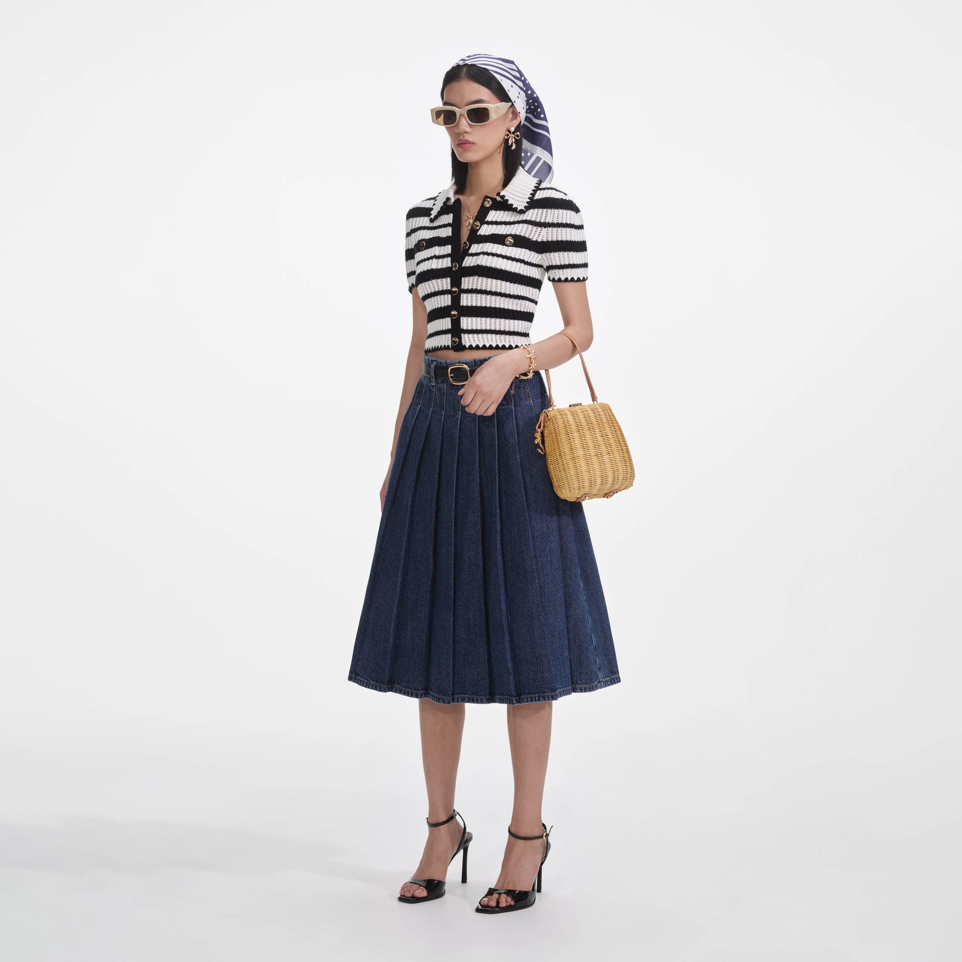 Side view of a woman wearing the Cream And Black Striped Crochet Top