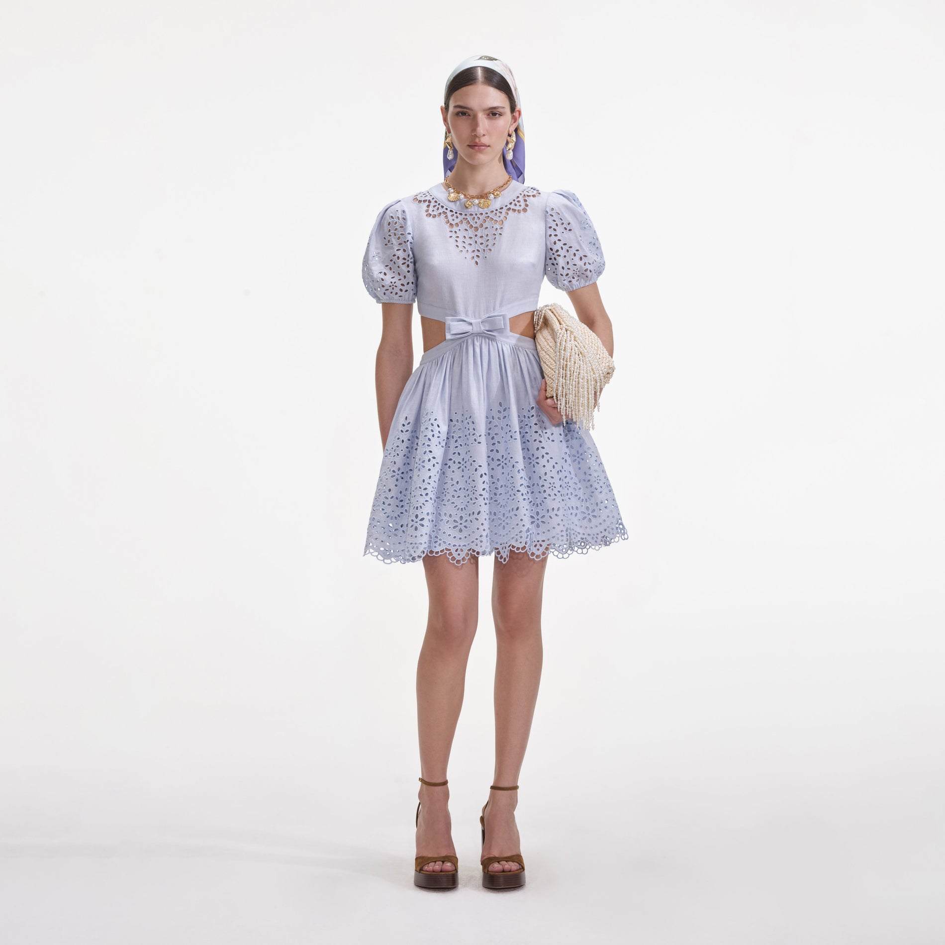 Front view of a woman wearing the Blue Embroidered Linen Mini Dress