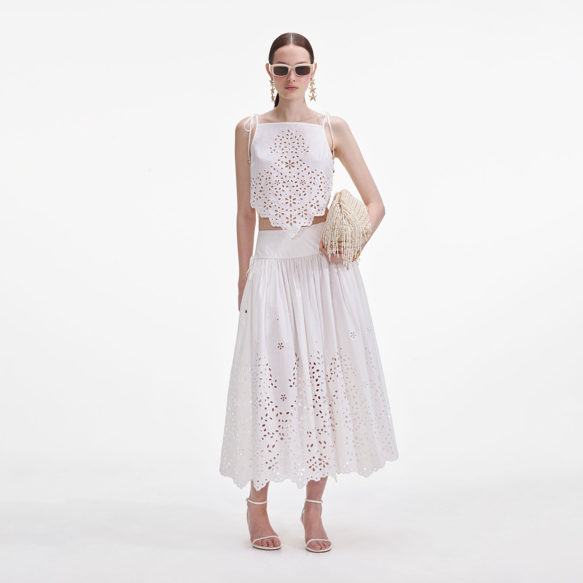 Front view of a woman wearing the White Cotton Embroidered Top