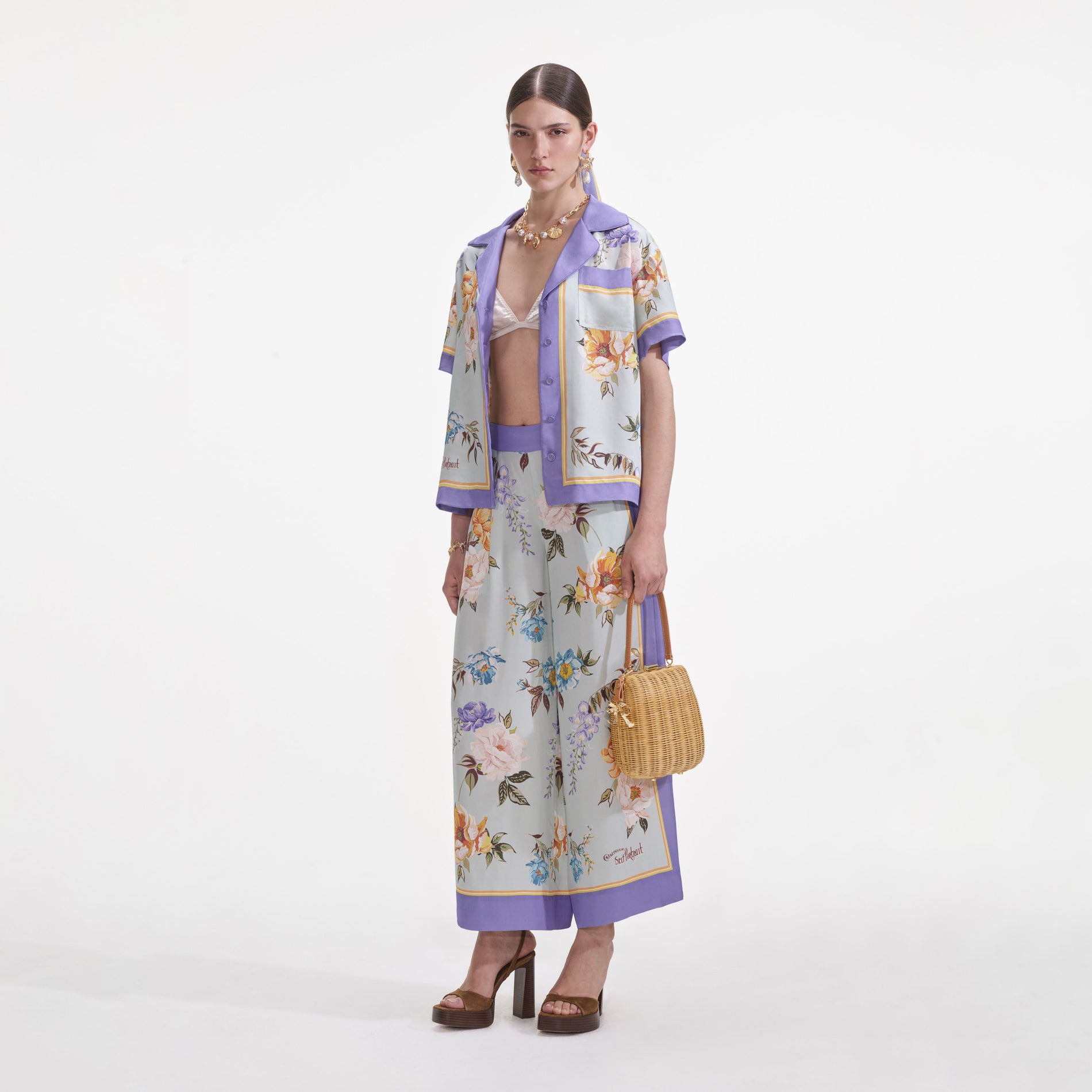 Side view of a woman wearing the Blue Floral Viscose Shirt