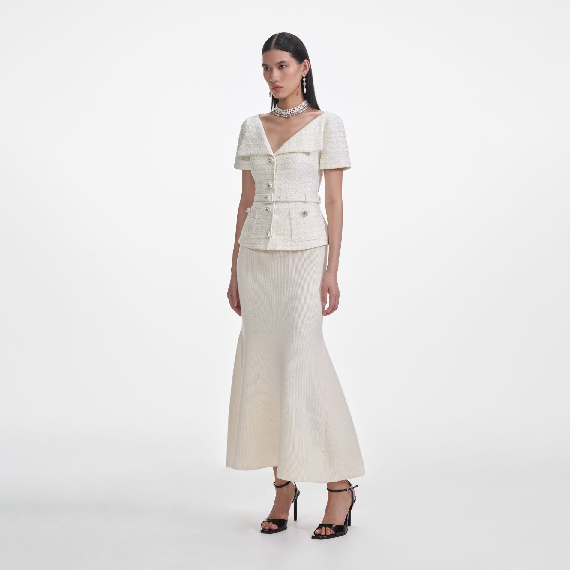 Side view of a woman wearing the Cream Boucle Top