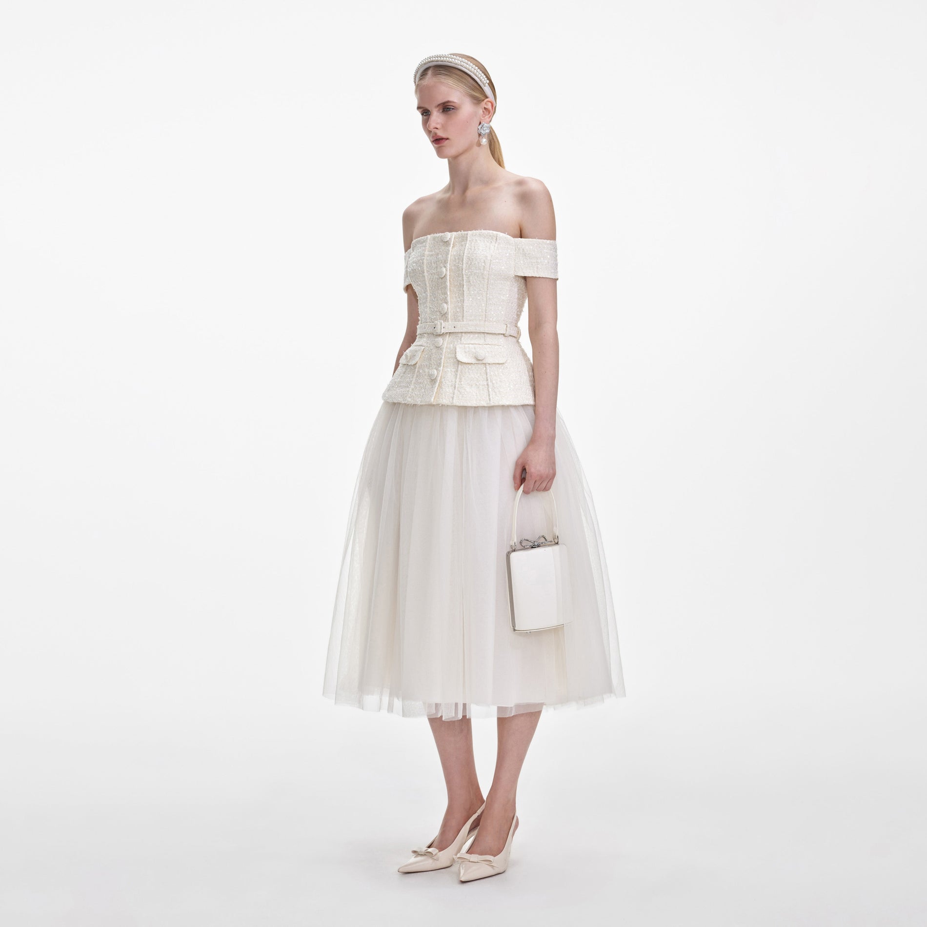 Side view of a woman wearing the Cream Boucle Tulle Midi Dress