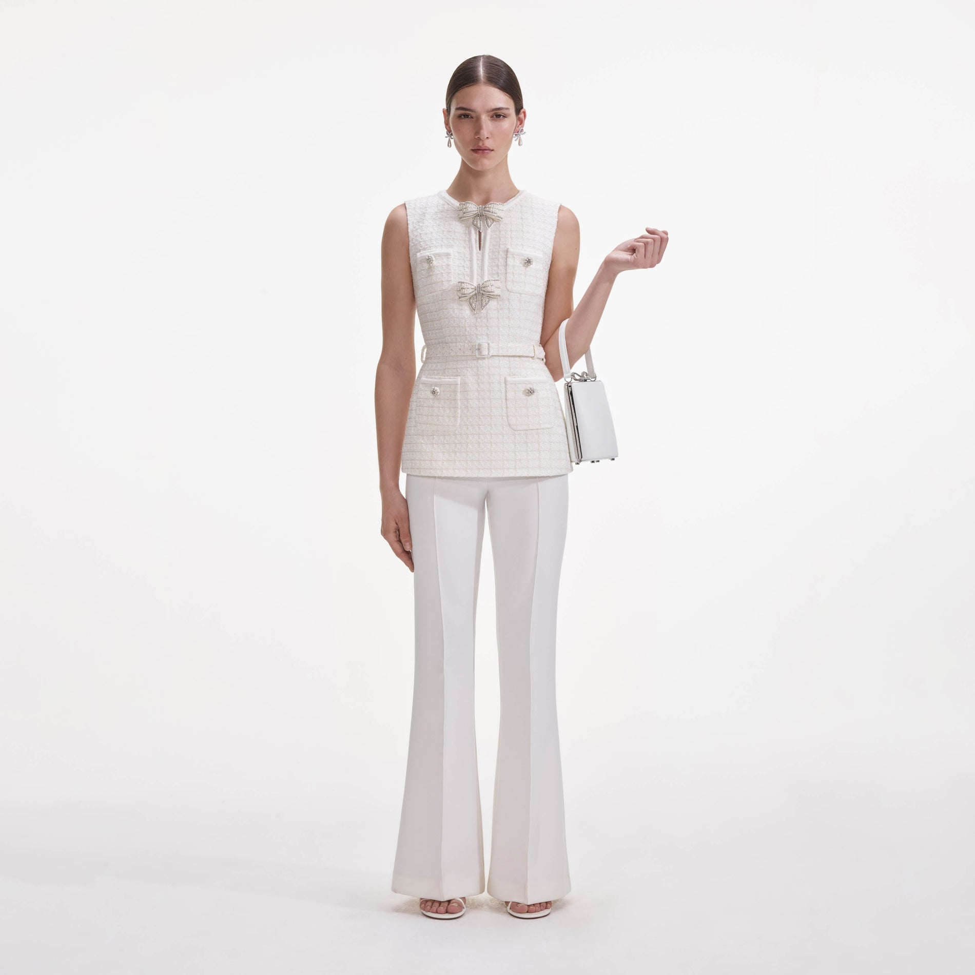 Front view of a woman wearing the Cream Boucle Bow Jumpsuit