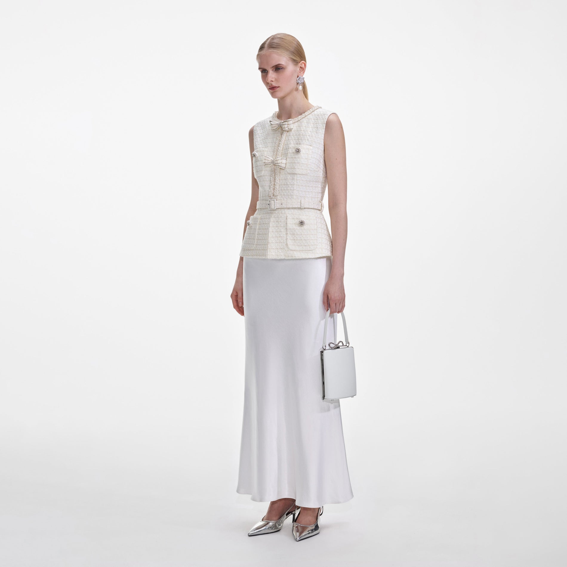 Side view of a woman wearing the Cream Boucle Midi Dress