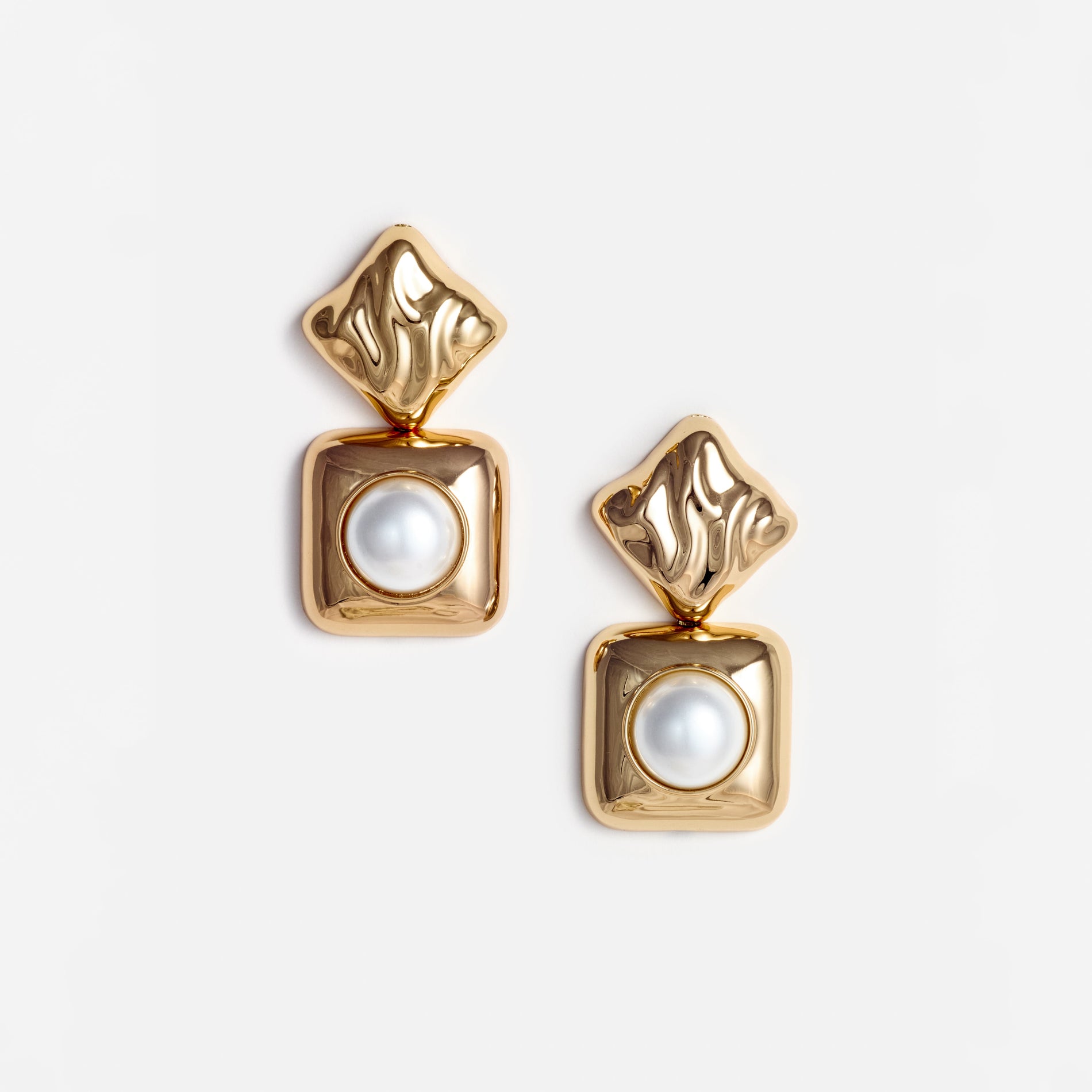 A photo of the Mottled Gold Pearl Tiered Earrings