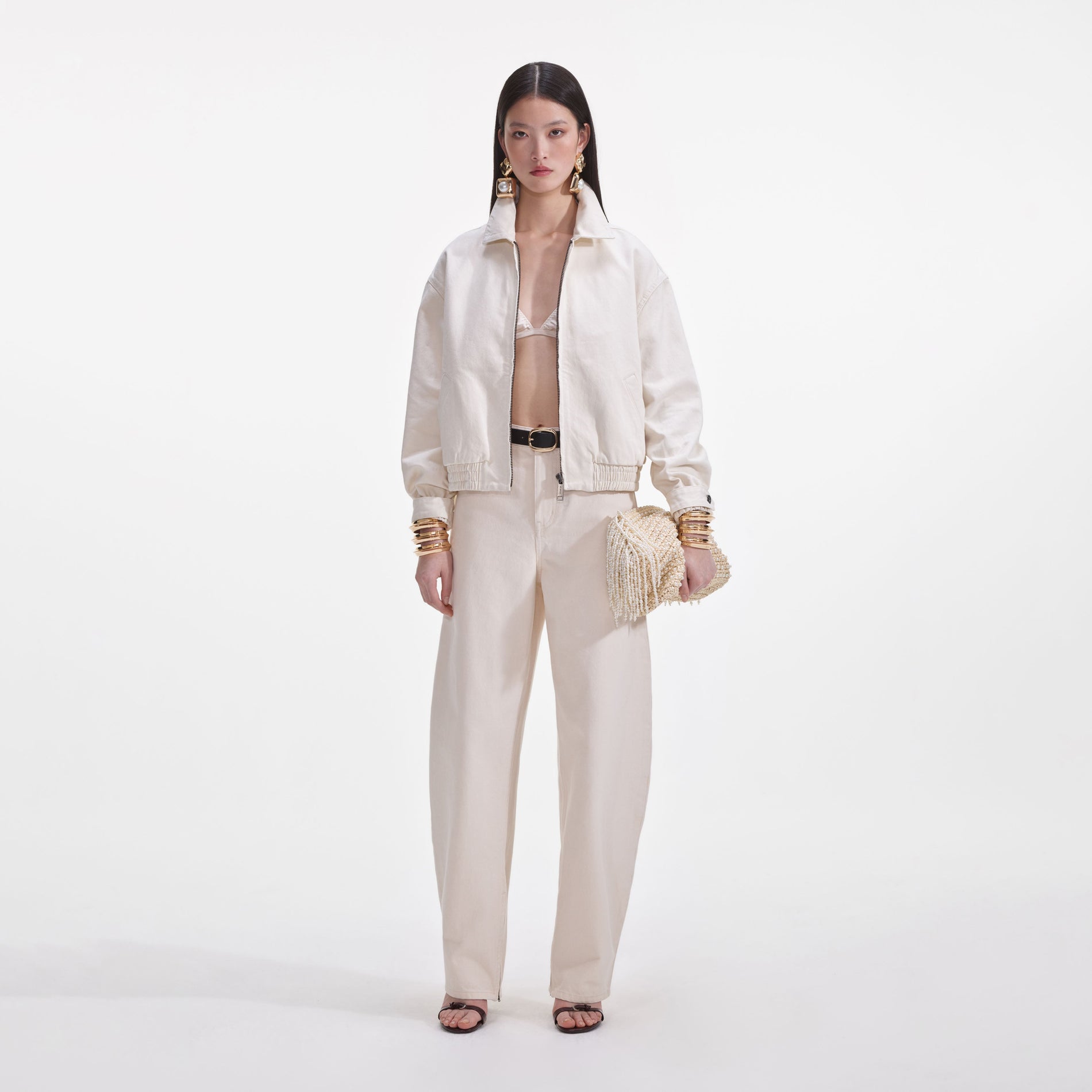 Front view of a woman wearing the Cream Lightweight Denim Jacket