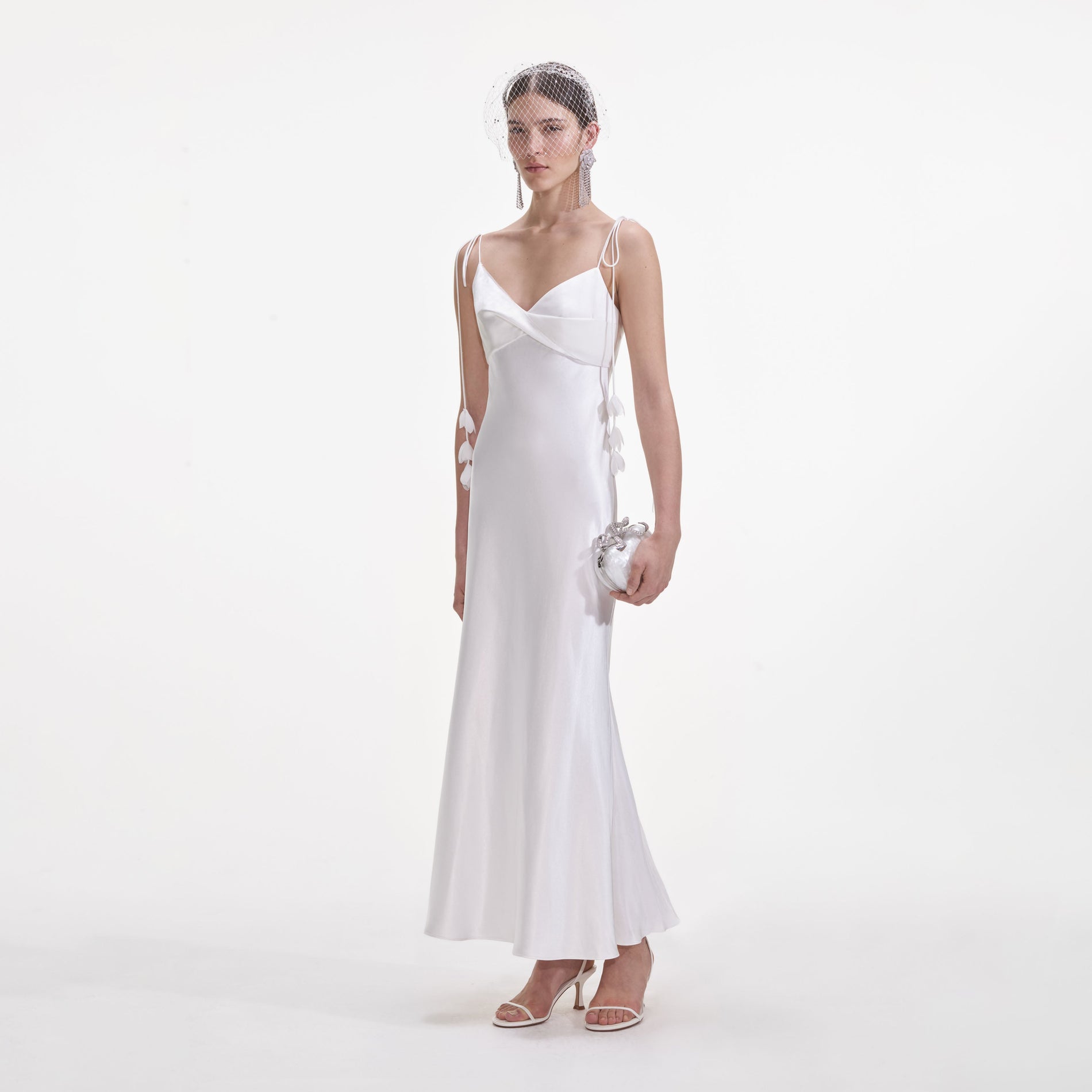 Side view of a woman wearing the White Satin Flower Midi Dress