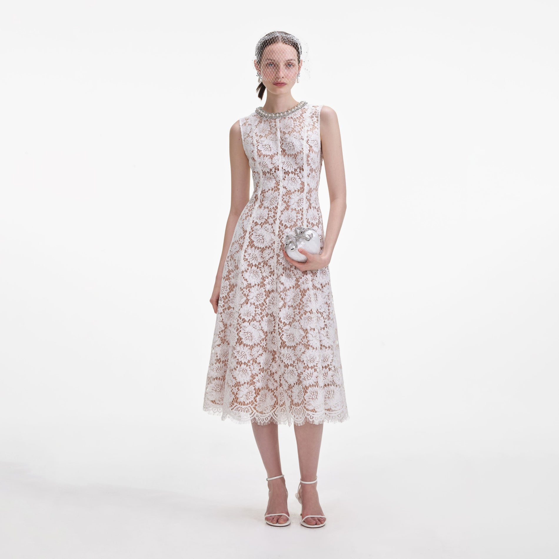 Front view of a woman wearing the White Fine Lace Pearl Midi Dress