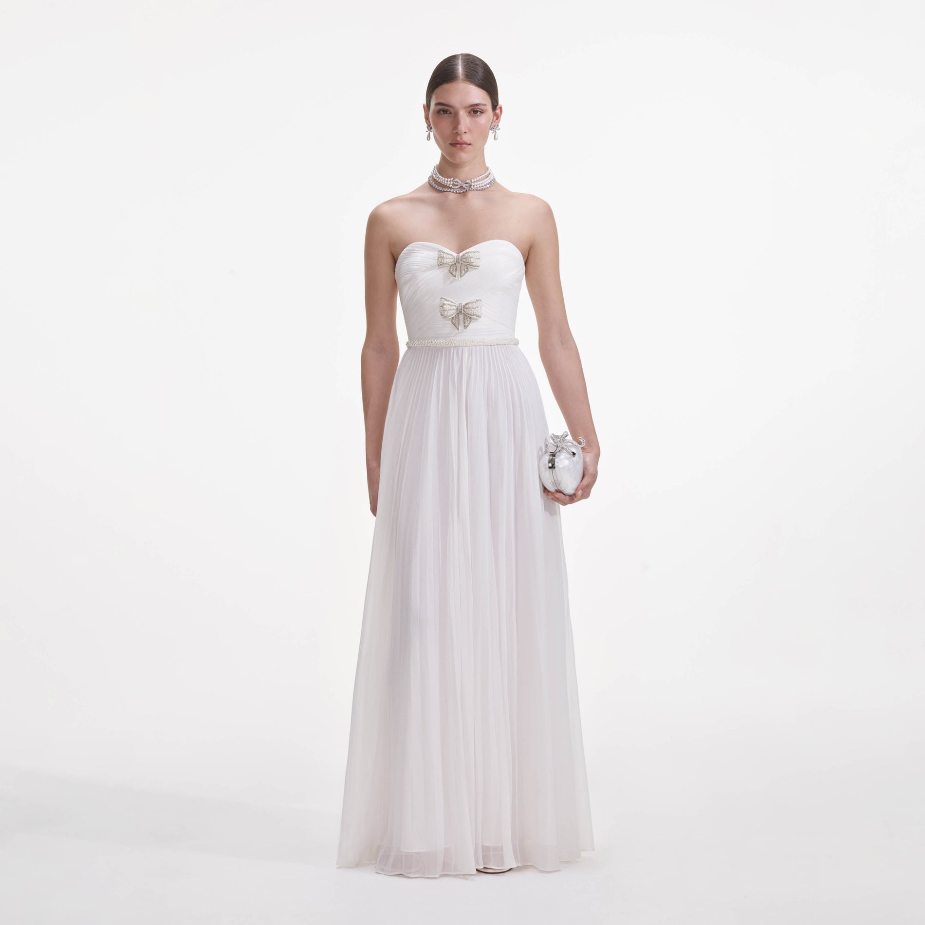 Front view of a woman wearing the White Chiffon Bow Maxi Dress