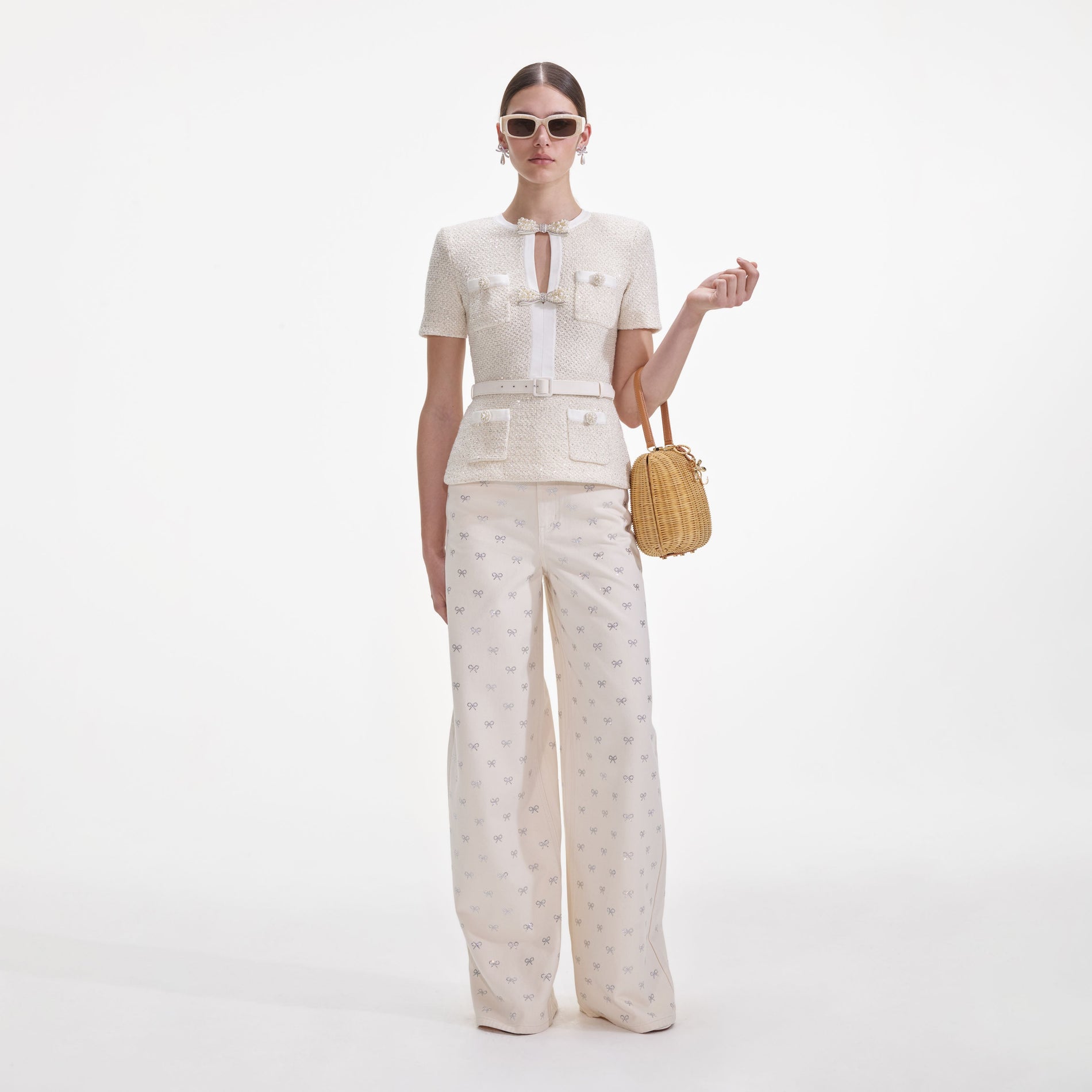 Front view of a woman wearing the Cream Sequin Knit Top