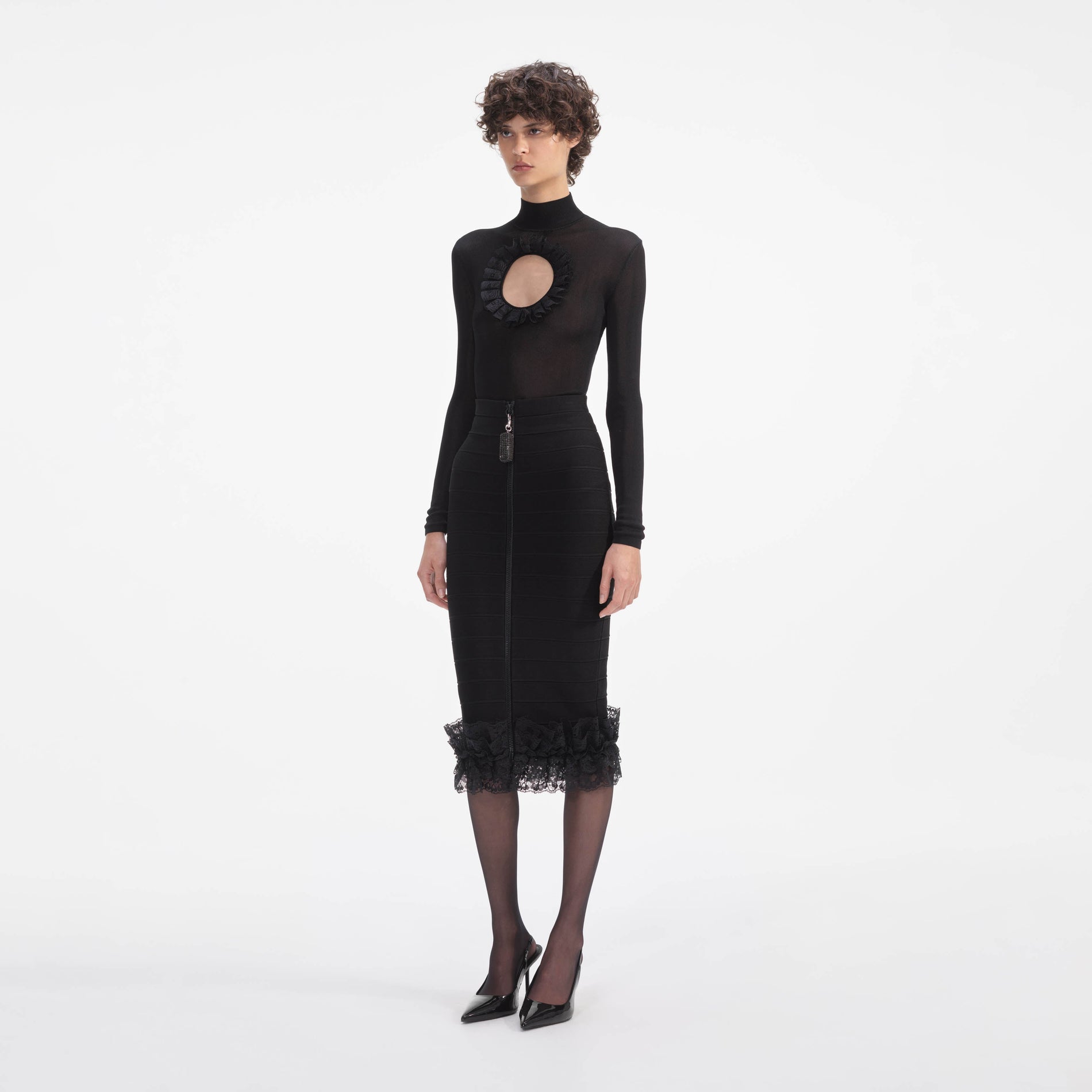 Side view of a woman wearing the Black Knit Cut Out Bodysuit