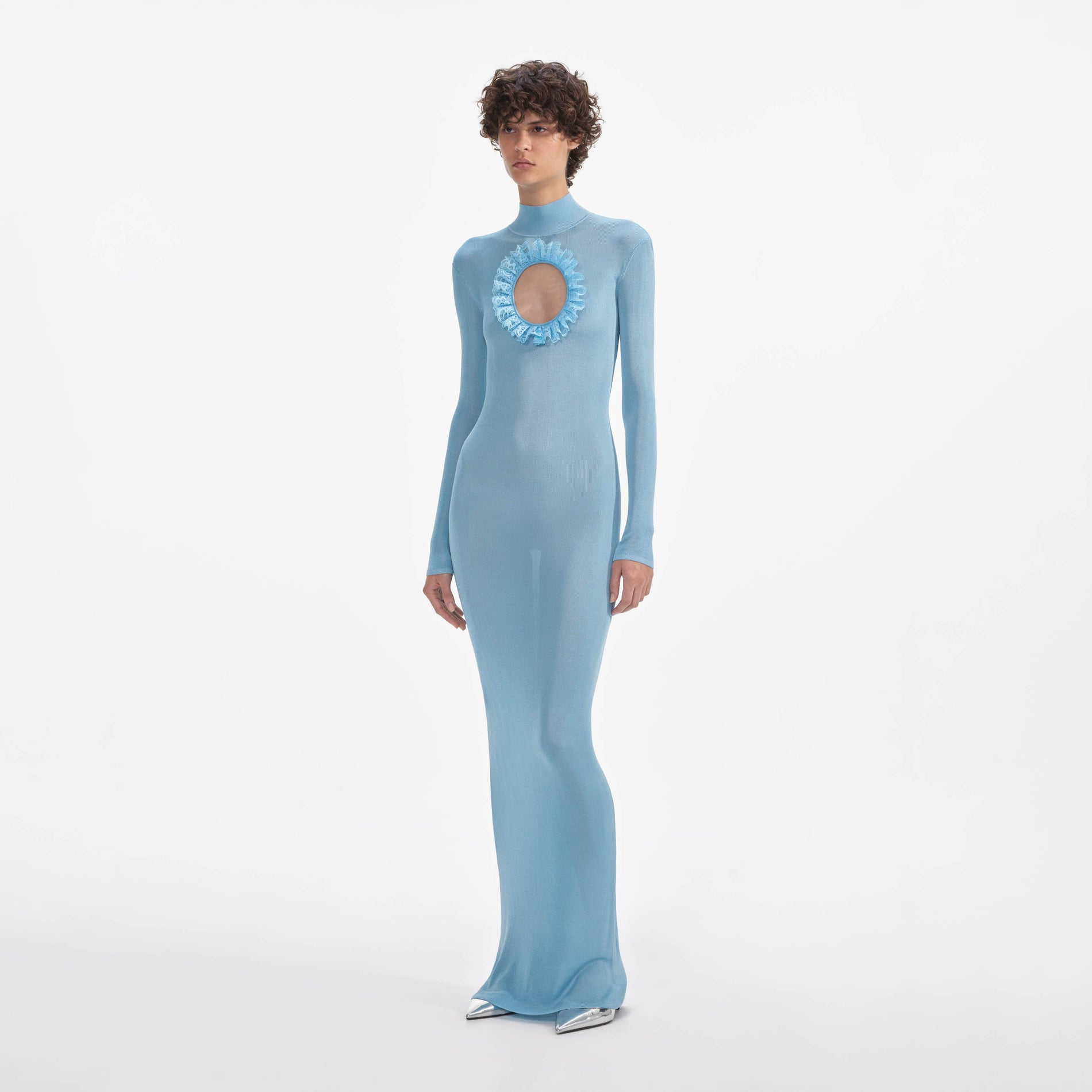 Side view of a woman wearing the Blue Knit Cut Out Maxi Dress