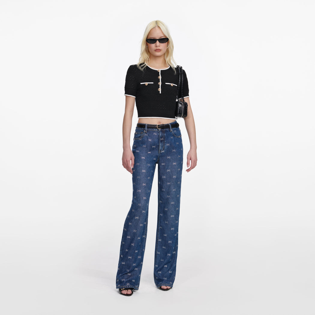 Front view of a woman wearing the Black Pointelle Knit Top