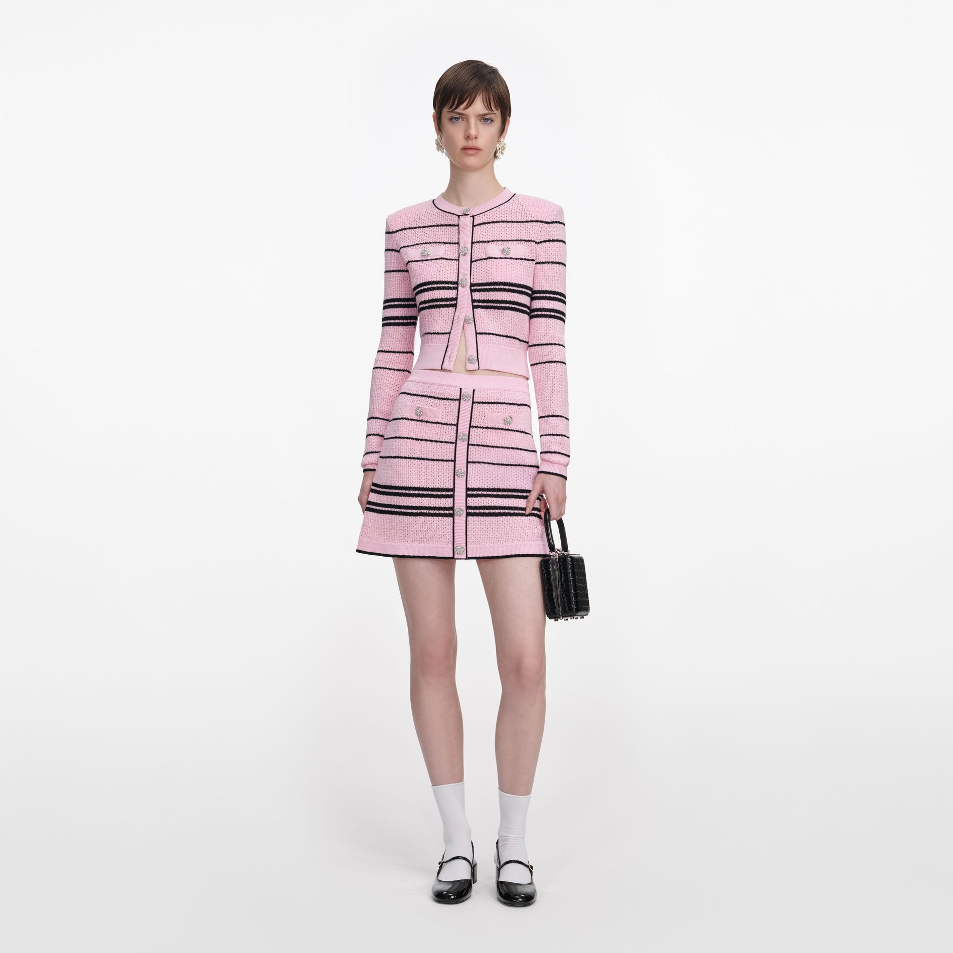 Front view of a woman wearing the Pink Stripe Knit Mini Skirt