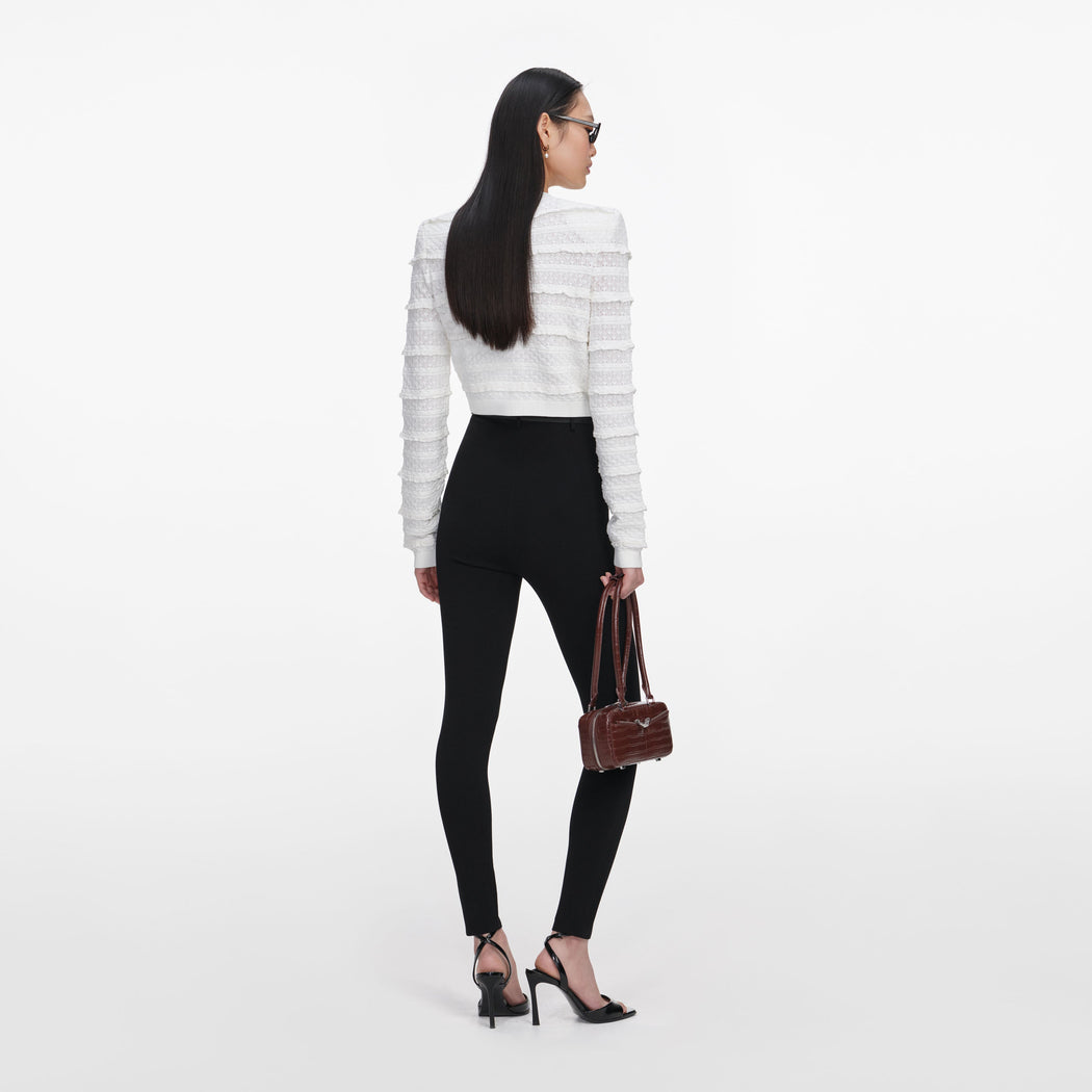 Back view of a woman wearing the White Pointelle Diamante Cardigan