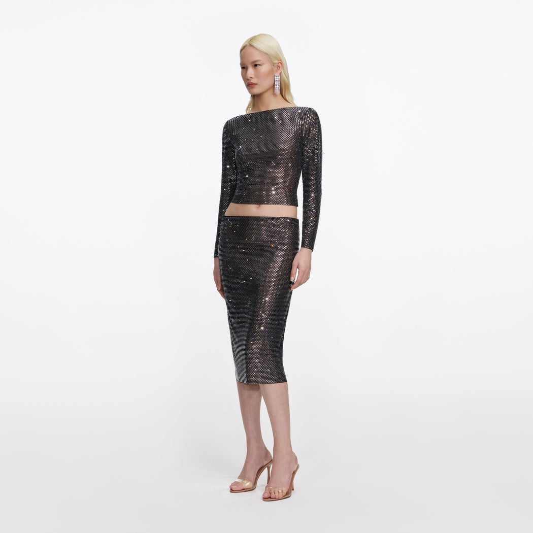 Side view of a woman wearing the Gunmetal Rhinestone Top