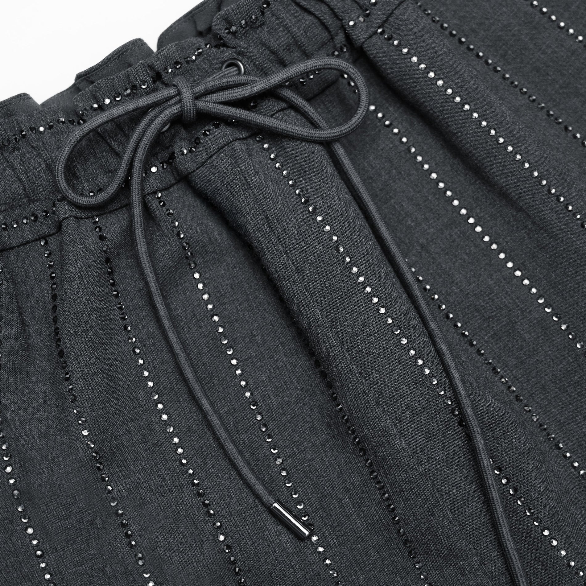 A close up of the fabric for the Grey Rhinestone Pinstripe Trousers