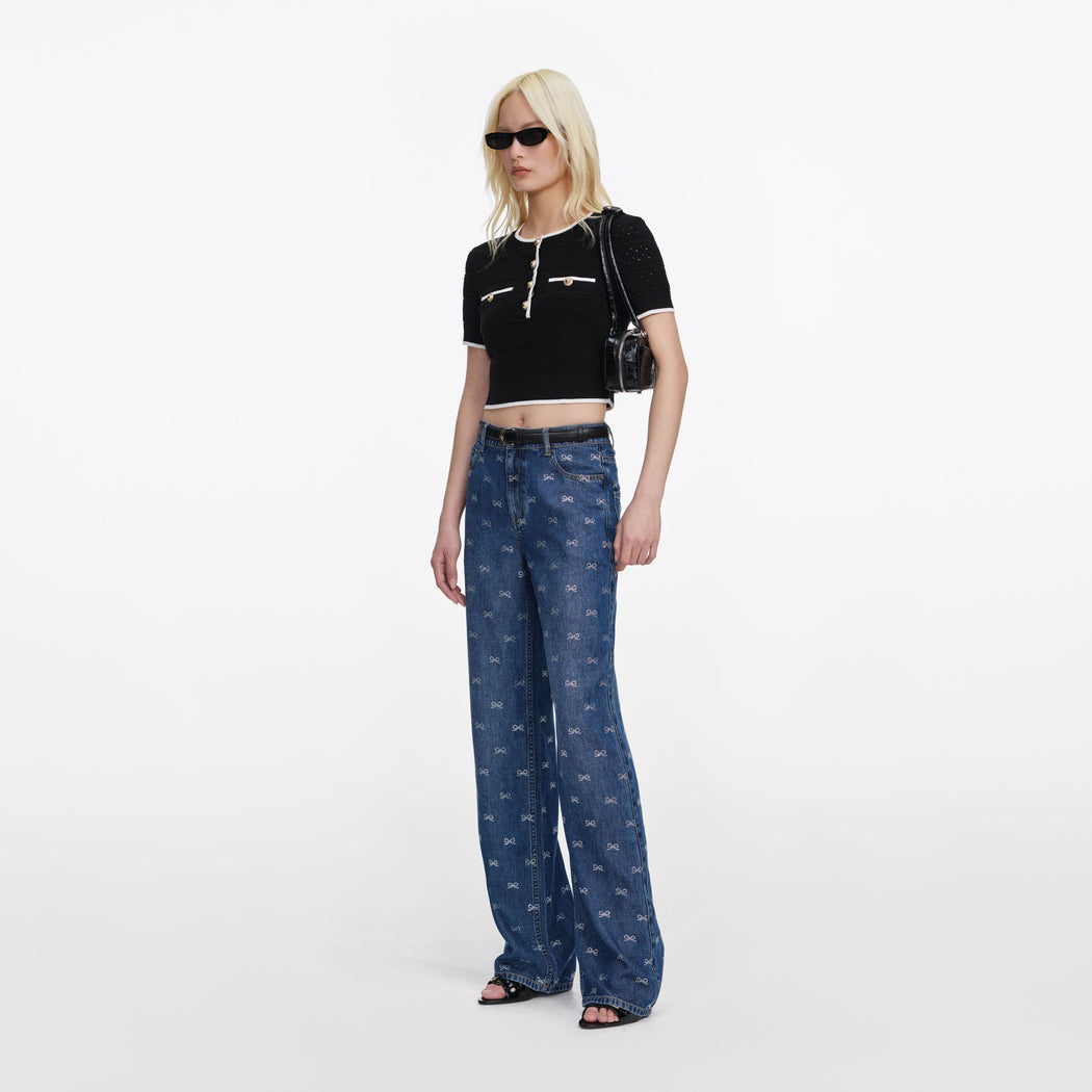 Side view of a woman wearing the Lightweight Bow Embellished Jeans
