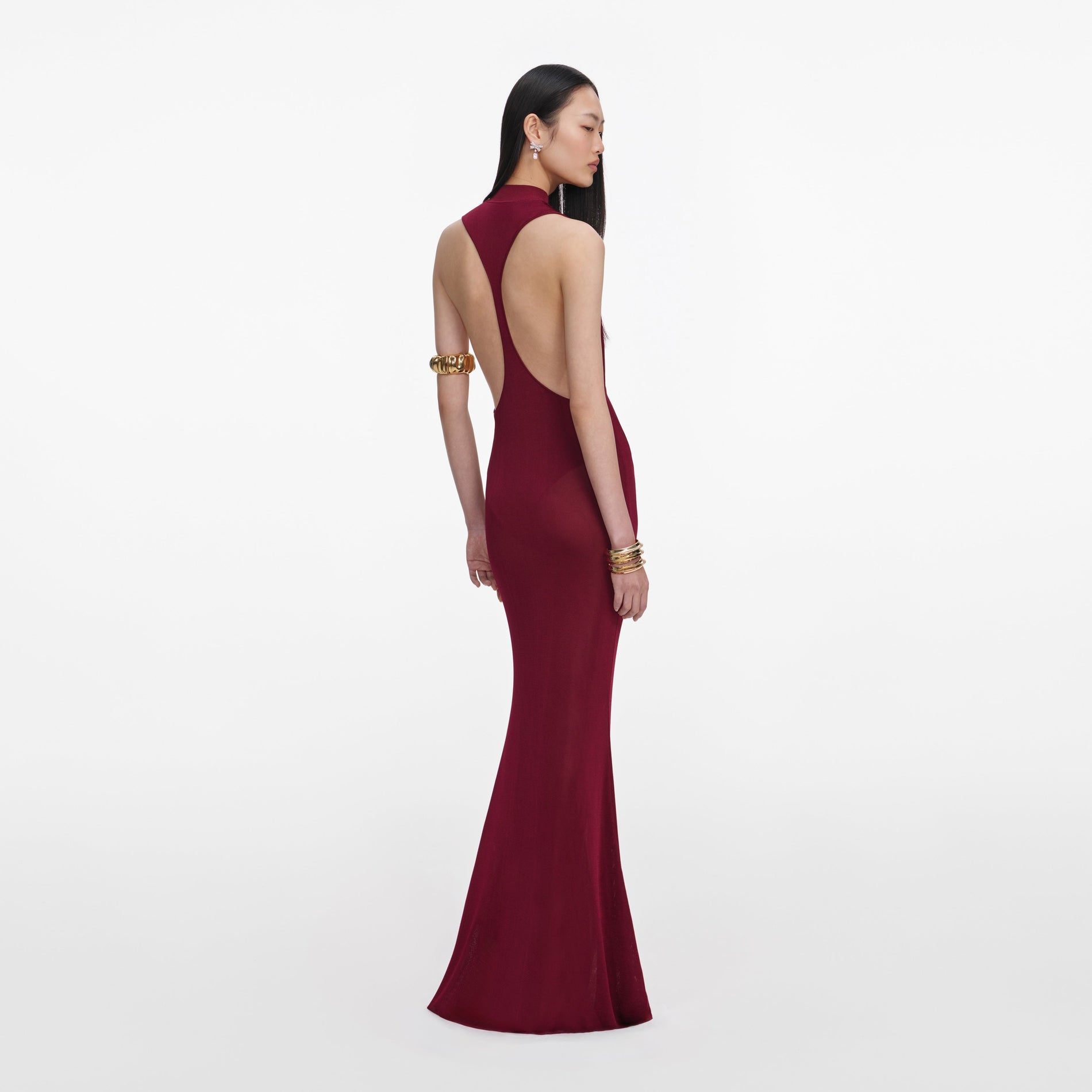 Back view of a woman wearing the Burgundy Racer Back Viscose Knit Maxi Dress
