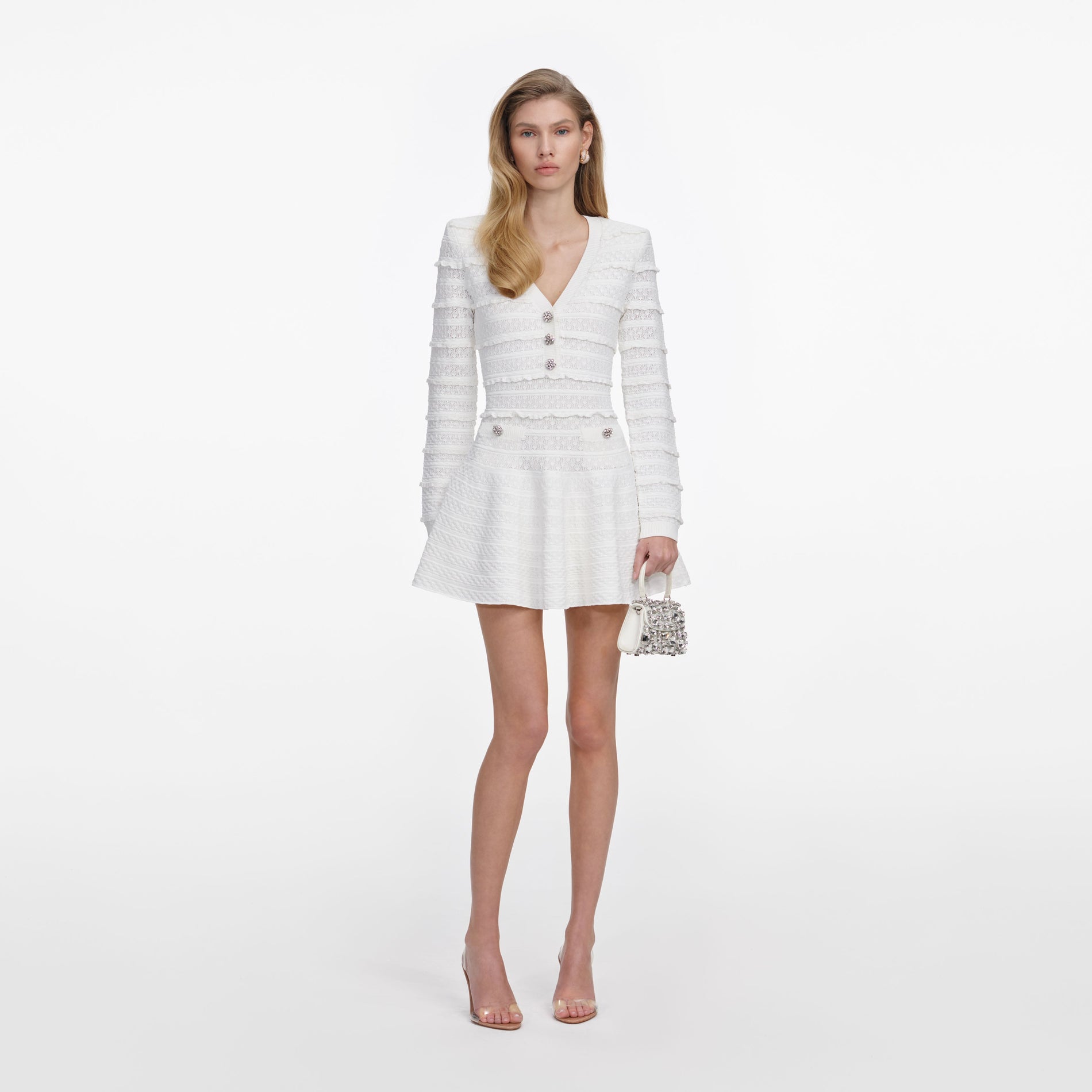 Front view of a woman wearing the White Pointelle Diamante Knit Mini Dress