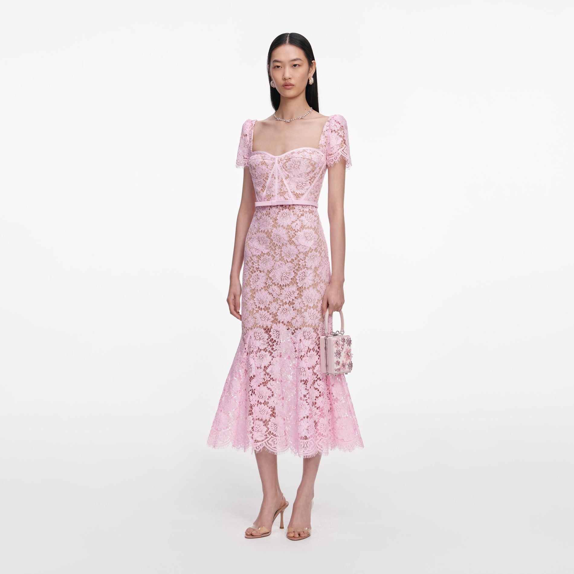 Side view of a woman wearing the Pink Fine Lace Midi Dress