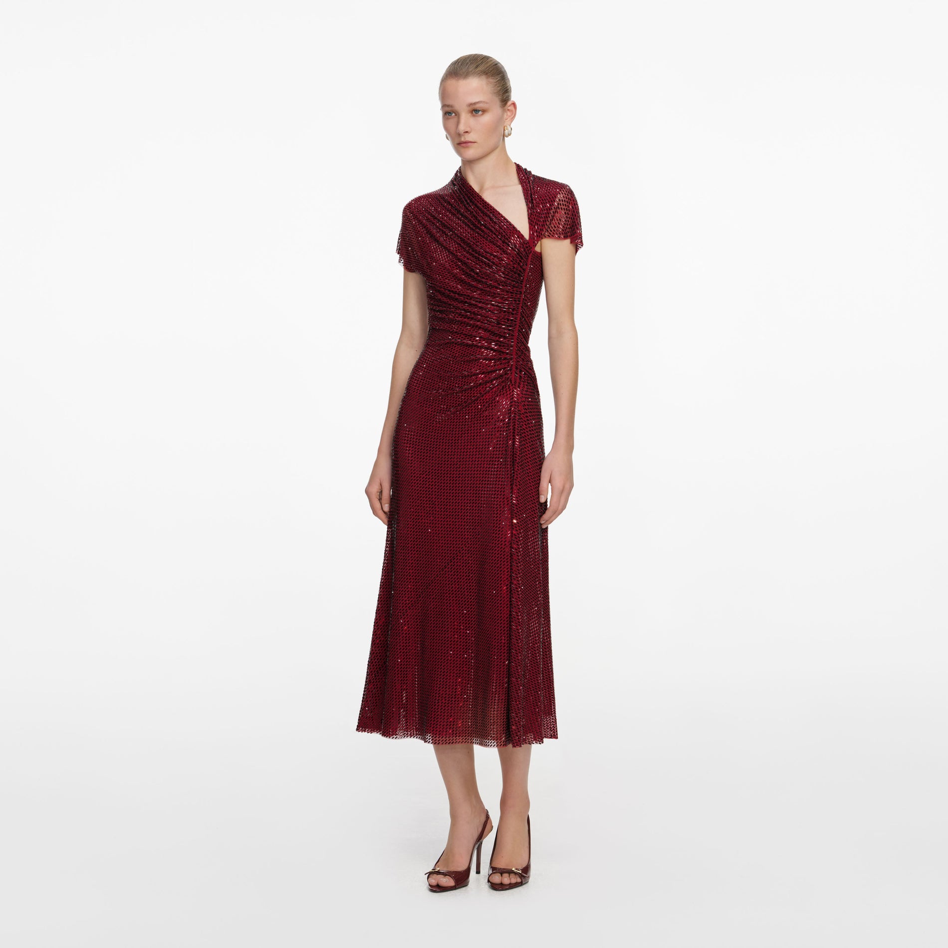 Side view of a woman wearing the Red Rhinestone Drape Midi Dress