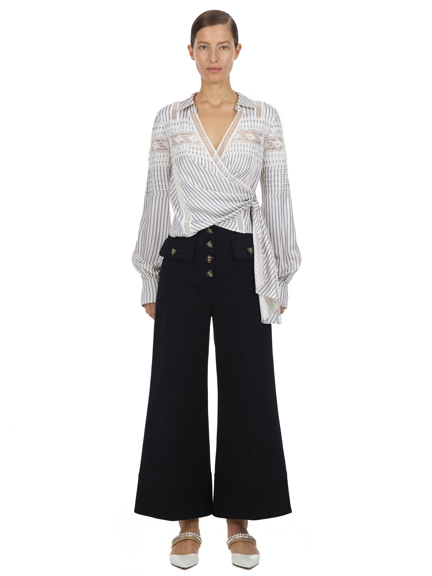 Front view of a woman wearing the Blue Striped Wrap Top