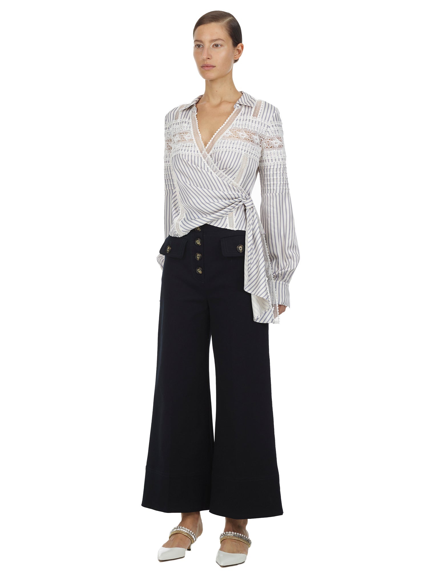 Side view of a woman wearing the Blue Striped Wrap Top