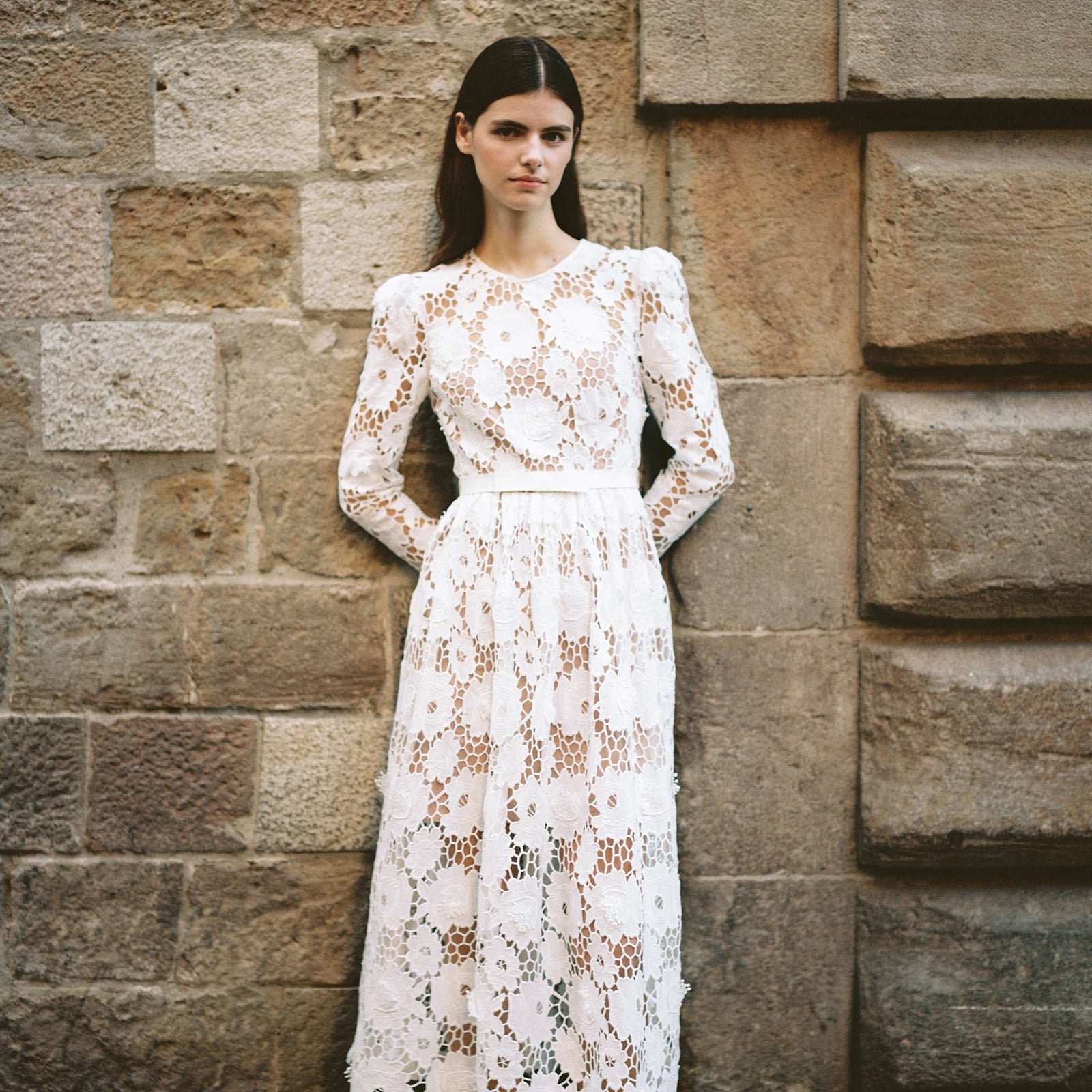 A woman wearing the White 3D Cotton Lace Midi Dress