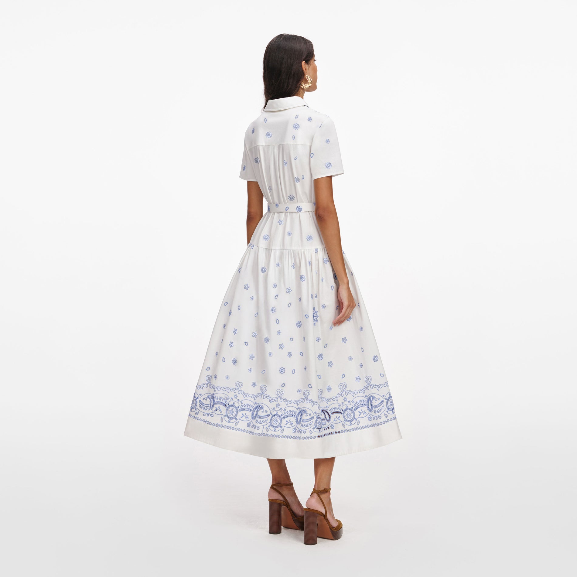 Back view of a woman wearing the White And Blue Embroidered Midi Dress