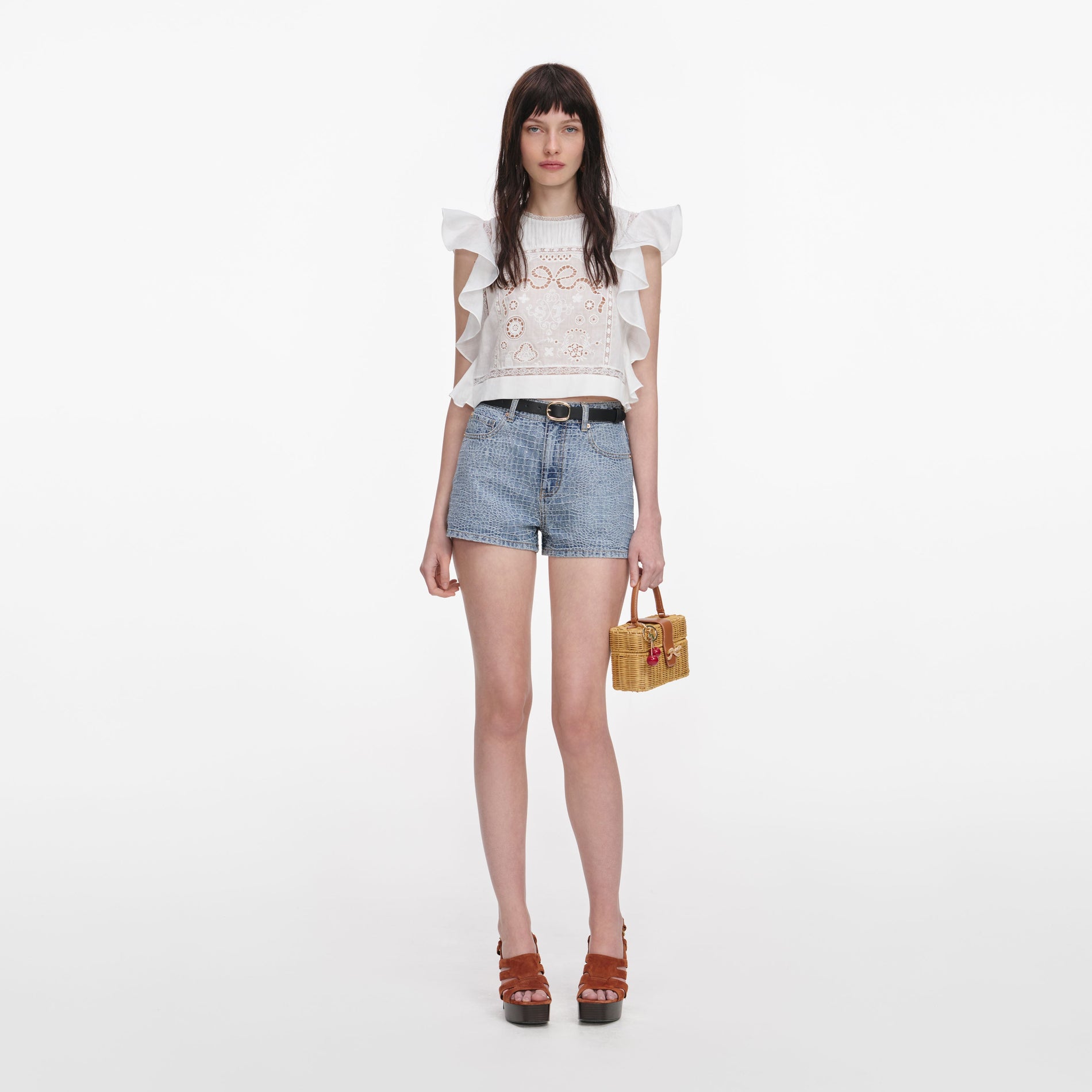 Front view of a woman wearing the White Ramie Lace Frill Top