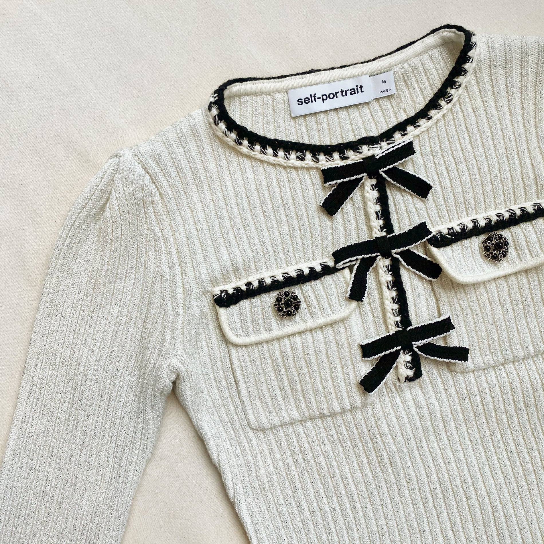 A close up of the fabric for the Melange Long Sleeve Knit Mini Dress