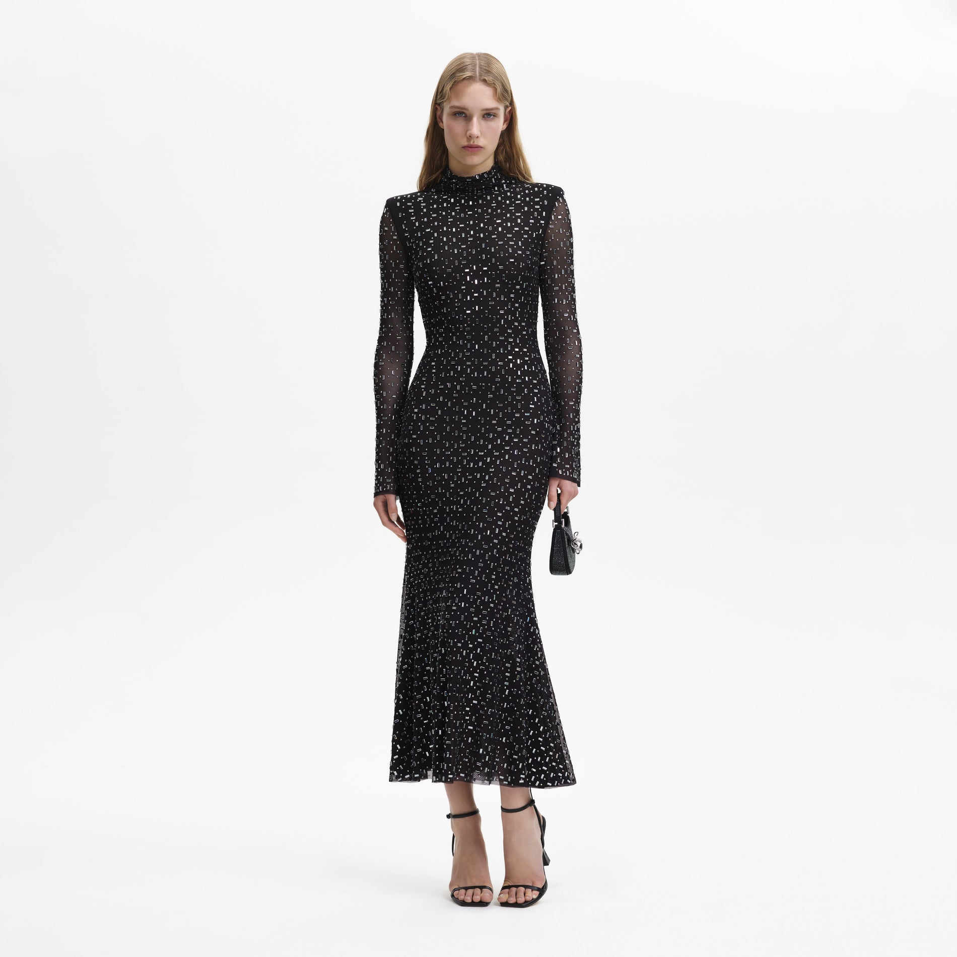 A woman wearing the Black Square Rhinestone Mesh Midi Dress