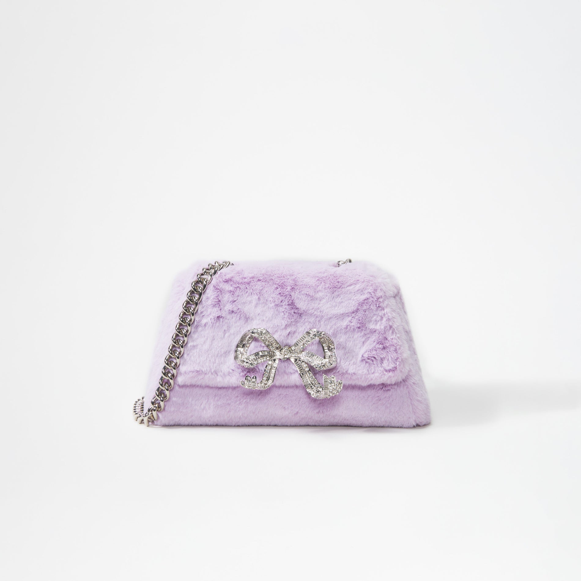 A woman wearing the Lilac Fluffy Bow Mini Bag