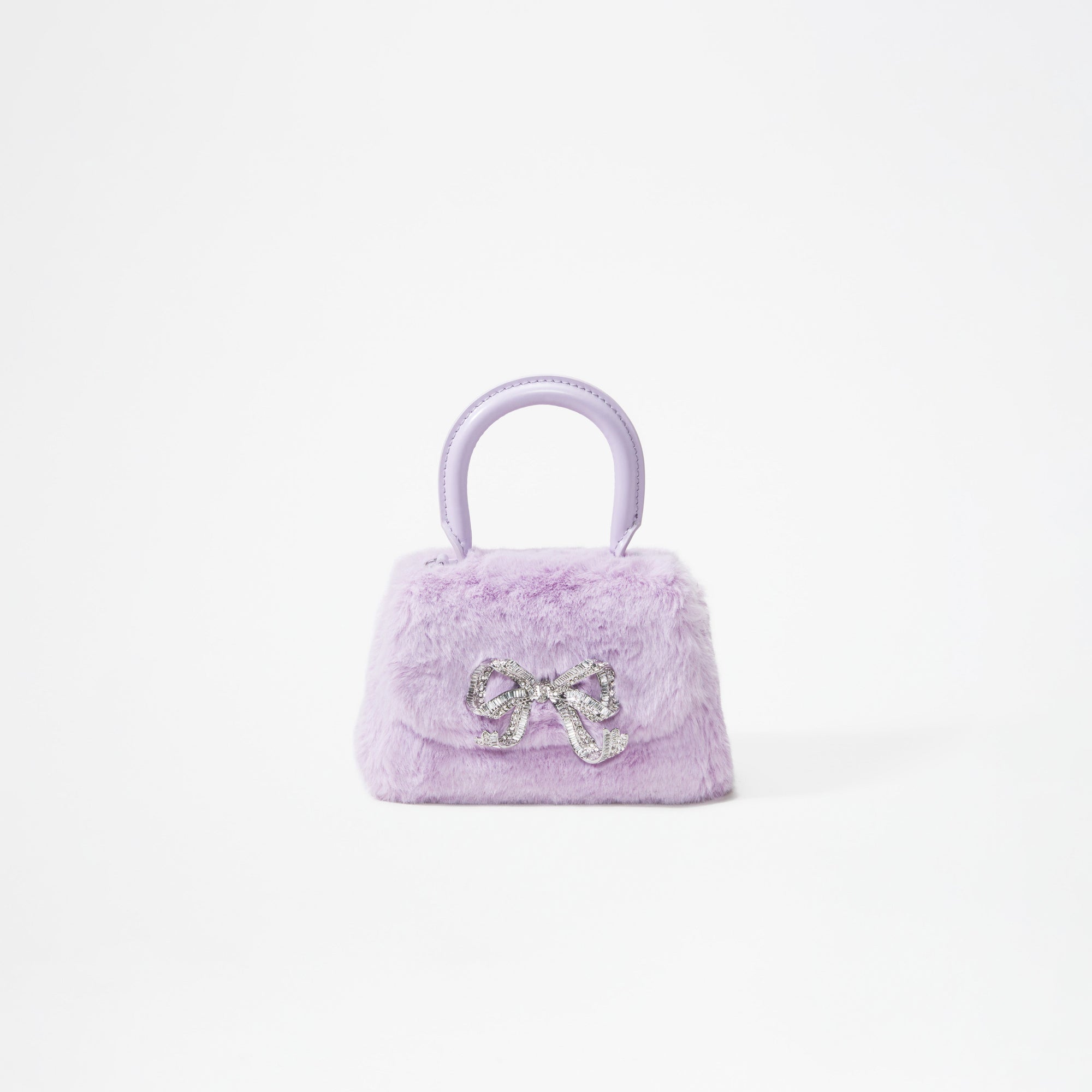 A woman wearing the Lilac Fluffy Bow Micro Bag