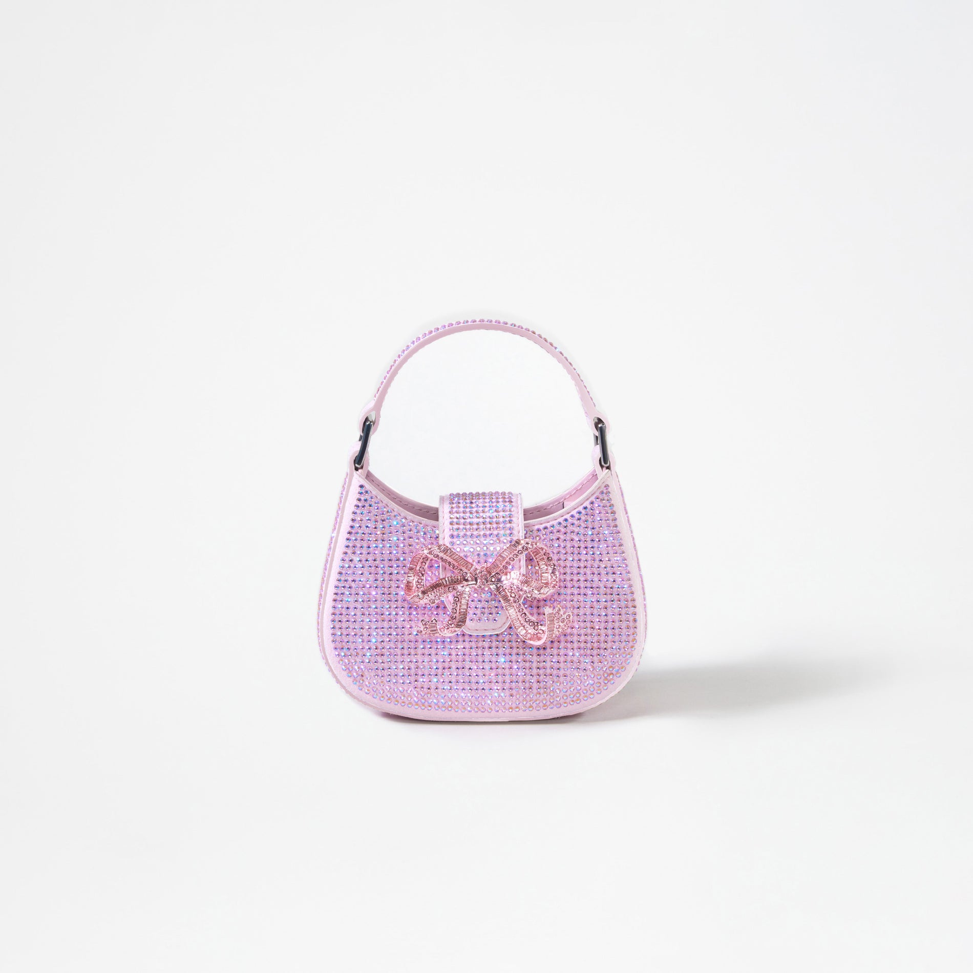 A woman wearing the Pink Rhinestone Crescent Bow Micro Bag