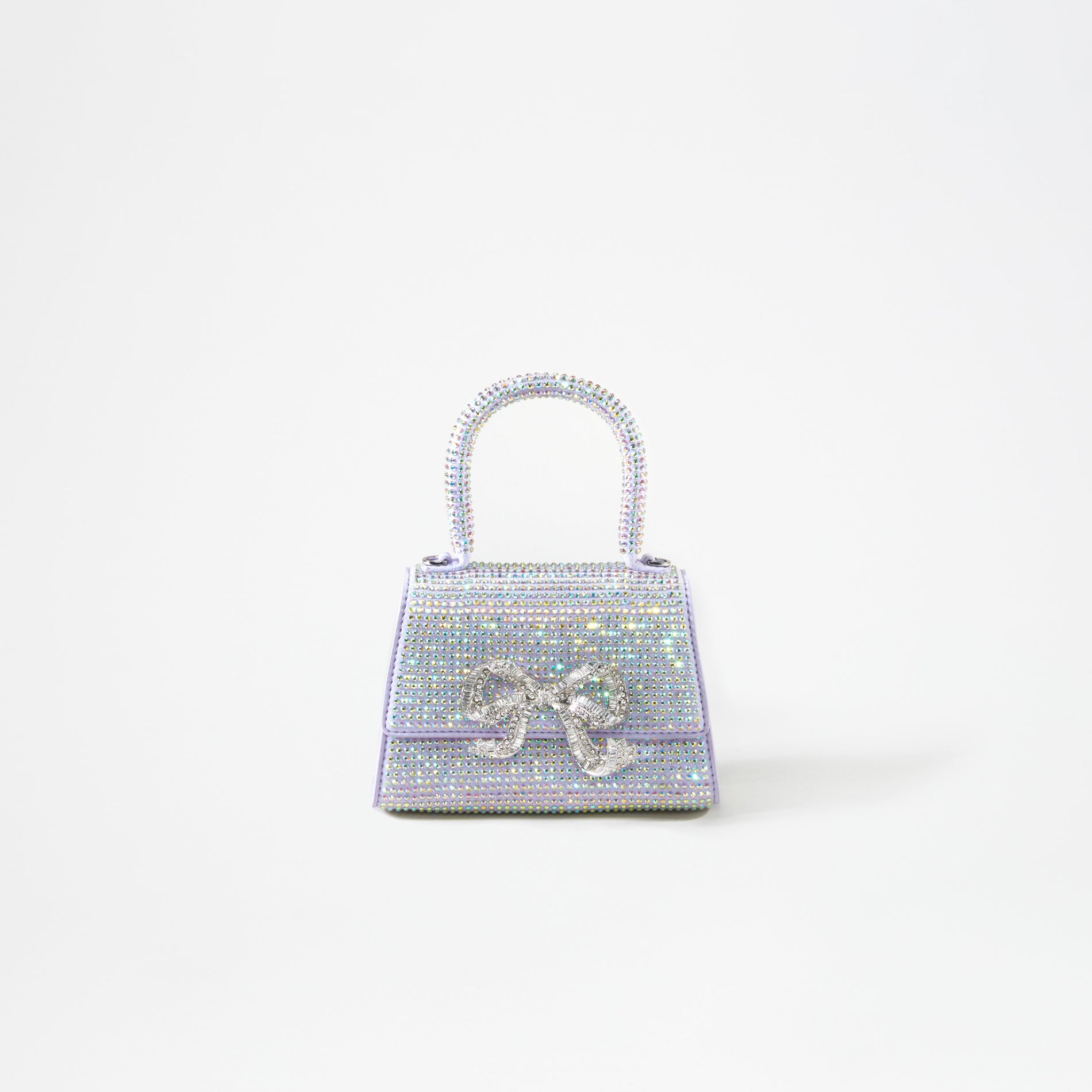 A woman wearing the Purple Rhinestone Bow Micro Bag