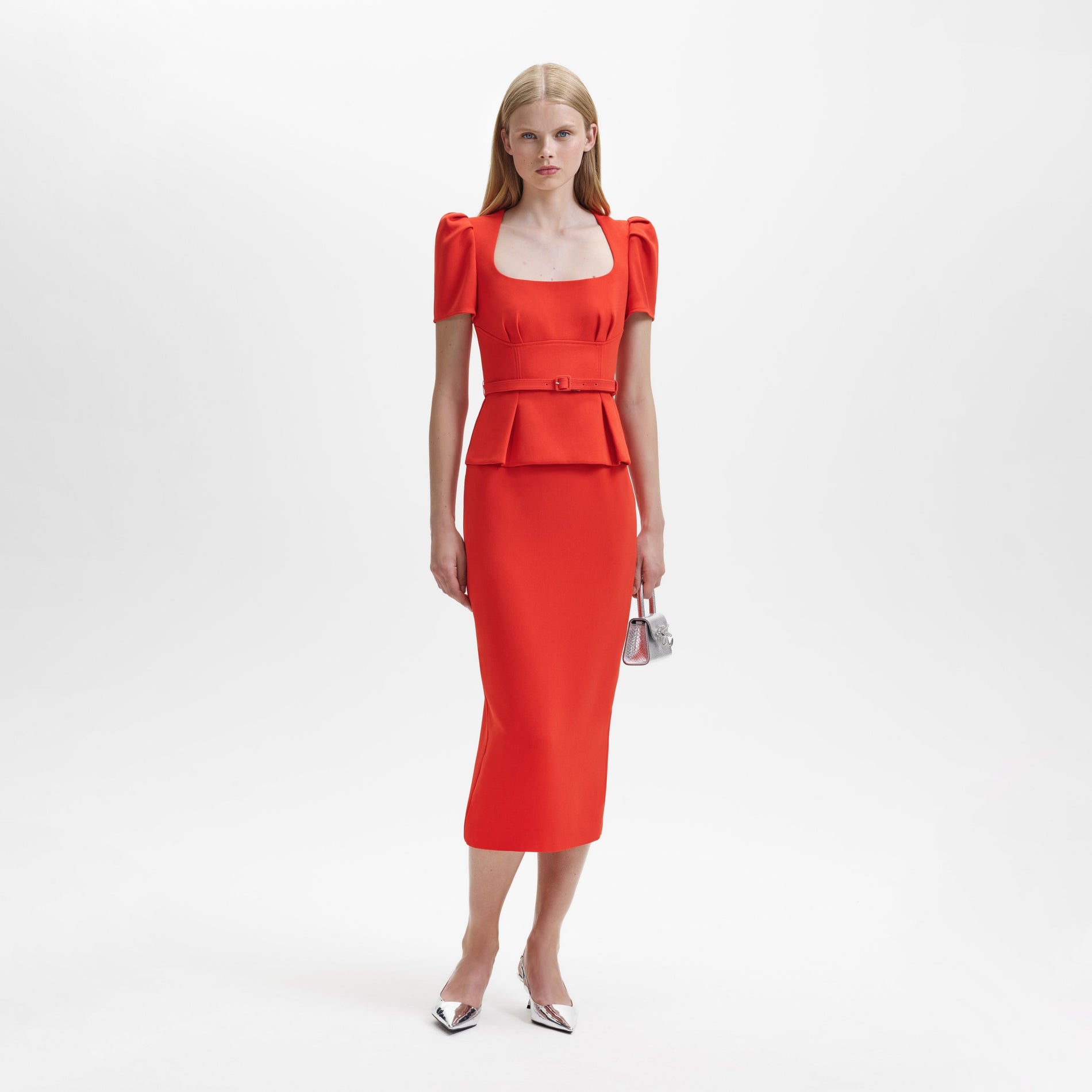 A woman wearing the Red Crepe Midi Dress