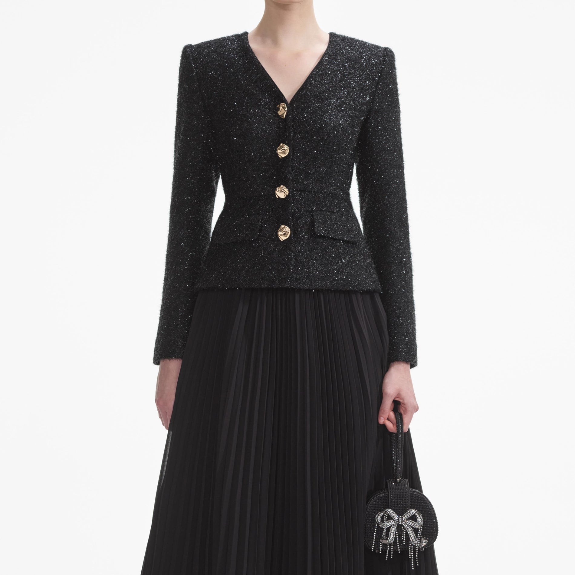 A close up of a woman wearing the Black Tinsel Boucle Chiffon Midi Dress