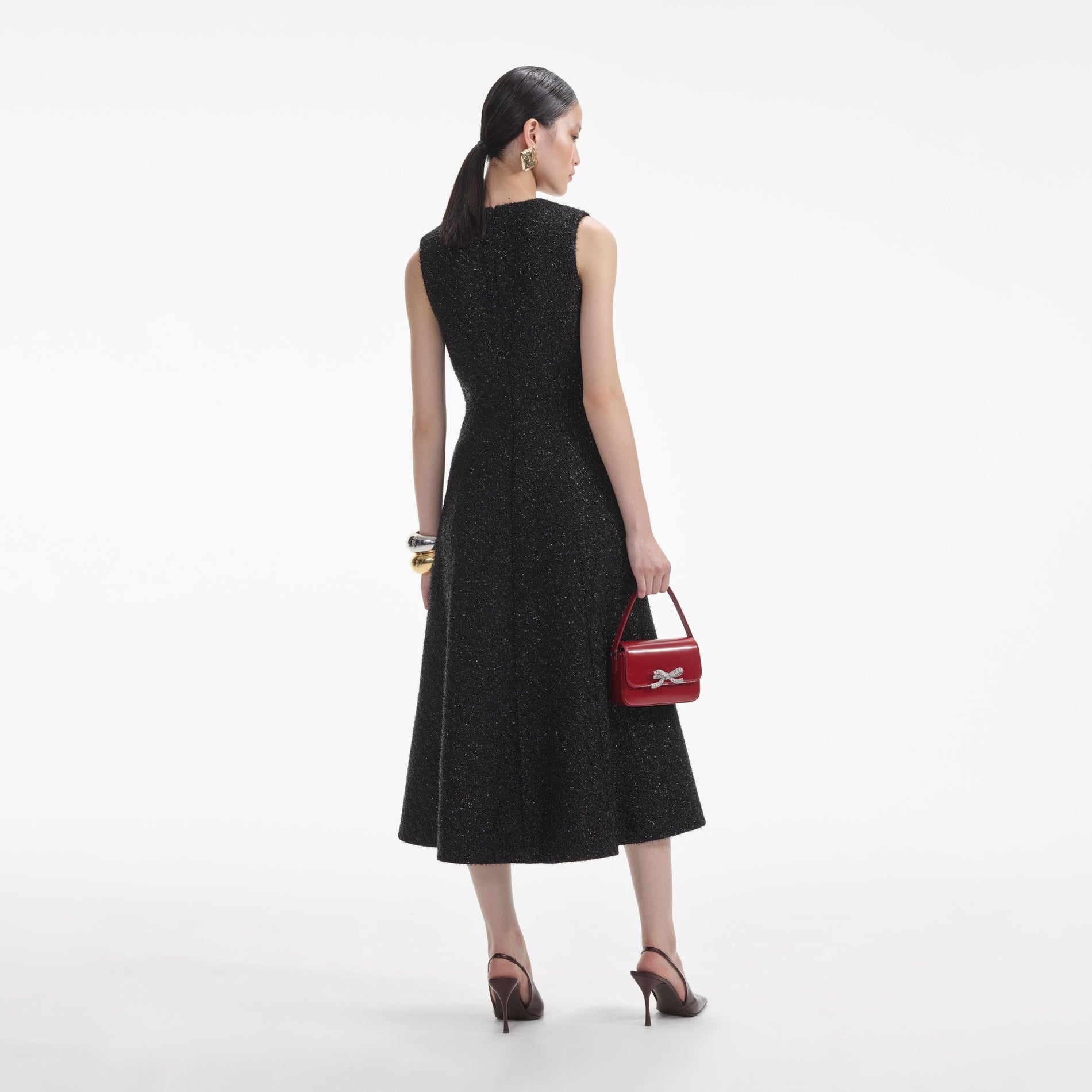 Back view of a woman wearing the White Black Tinsel Boucle Buttoned Midi Dress