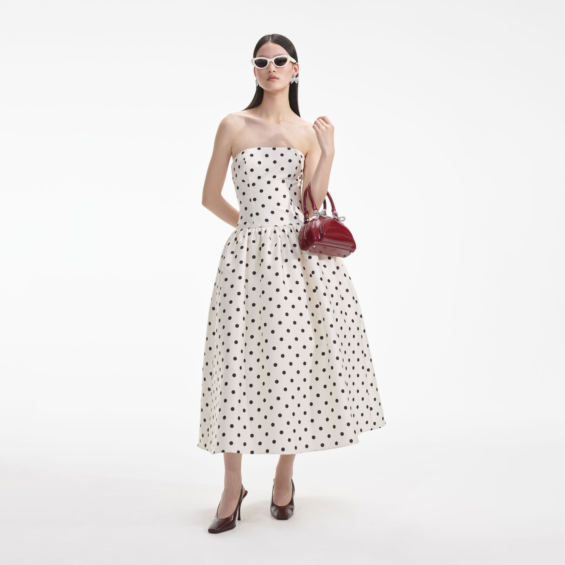 Front view of a woman wearing the Cream Polka Dot Taffeta Midi Dress