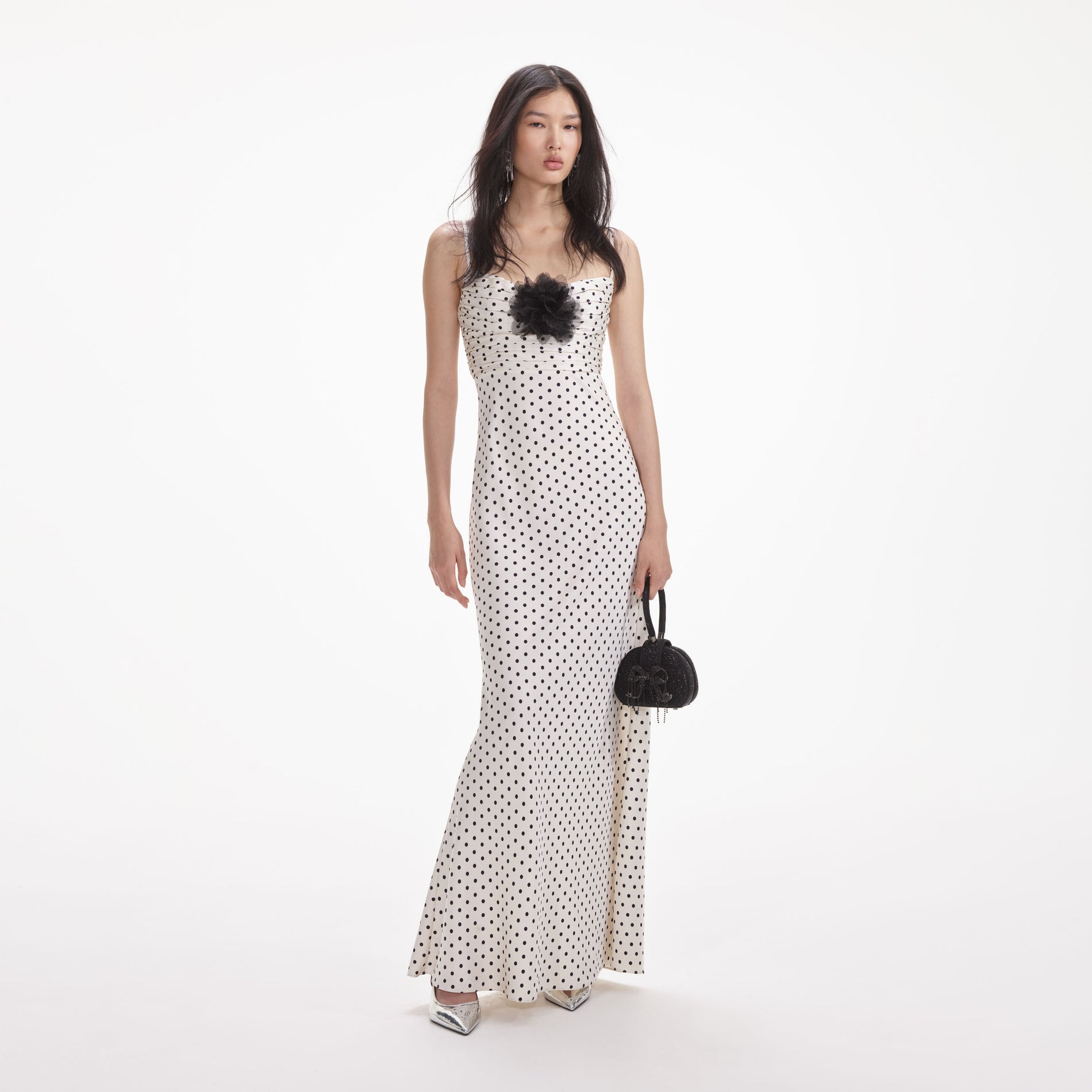 Front view of a woman wearing the Cream Polka Dot Satin Maxi Dress