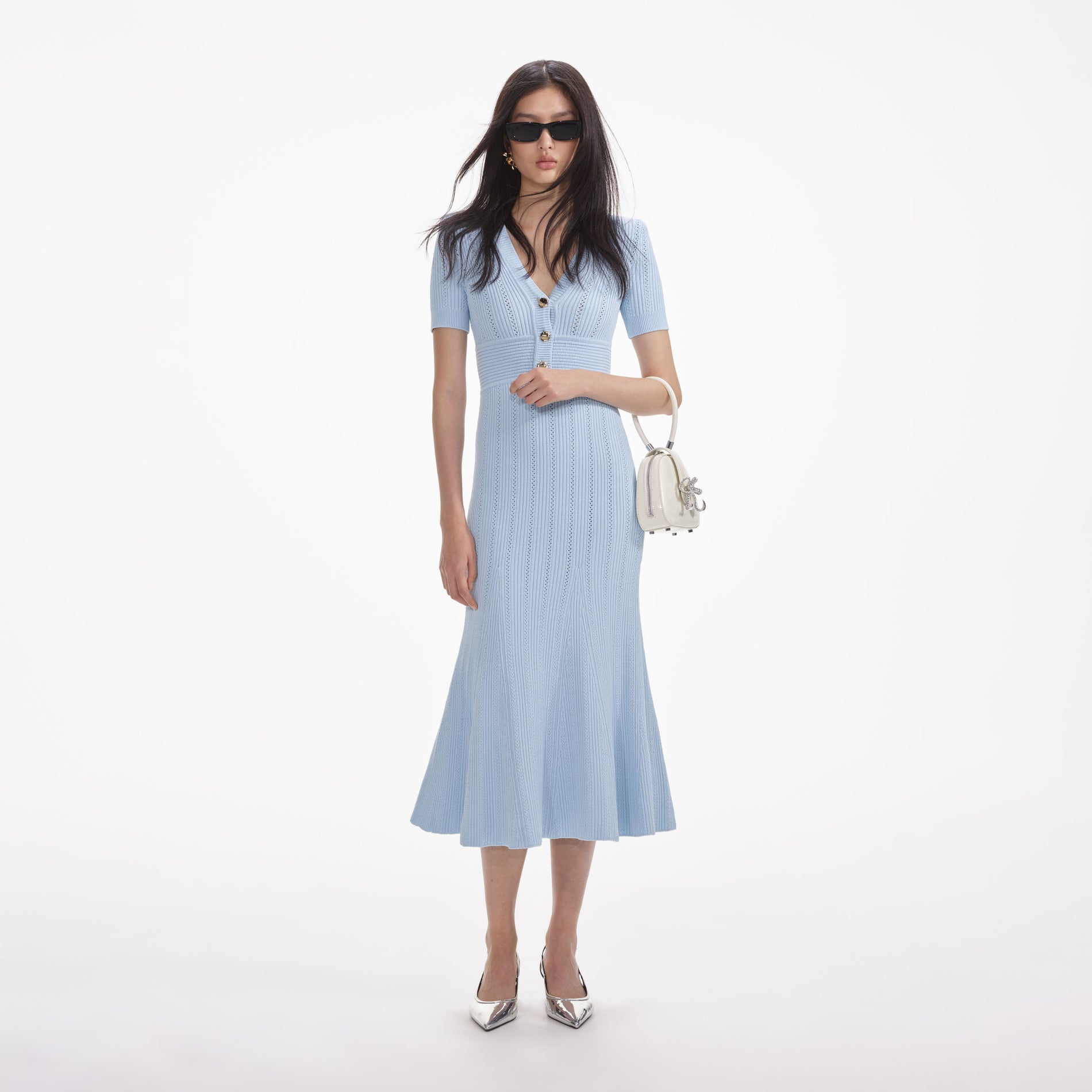 Front view of a woman wearing the Blue Pointelle Knit Midi Dress