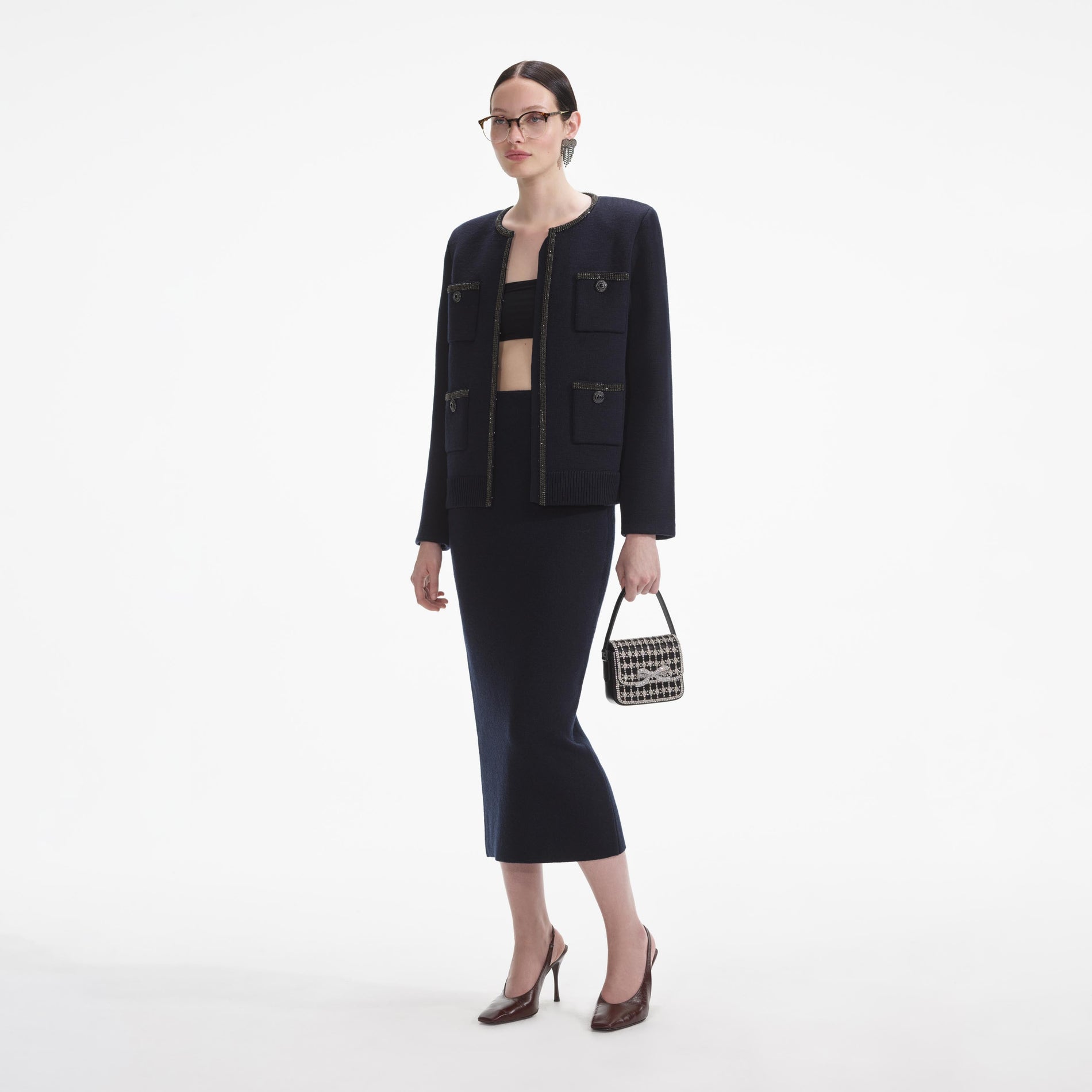 Side view of a woman wearing the Navy Embellished Knit Cardigan