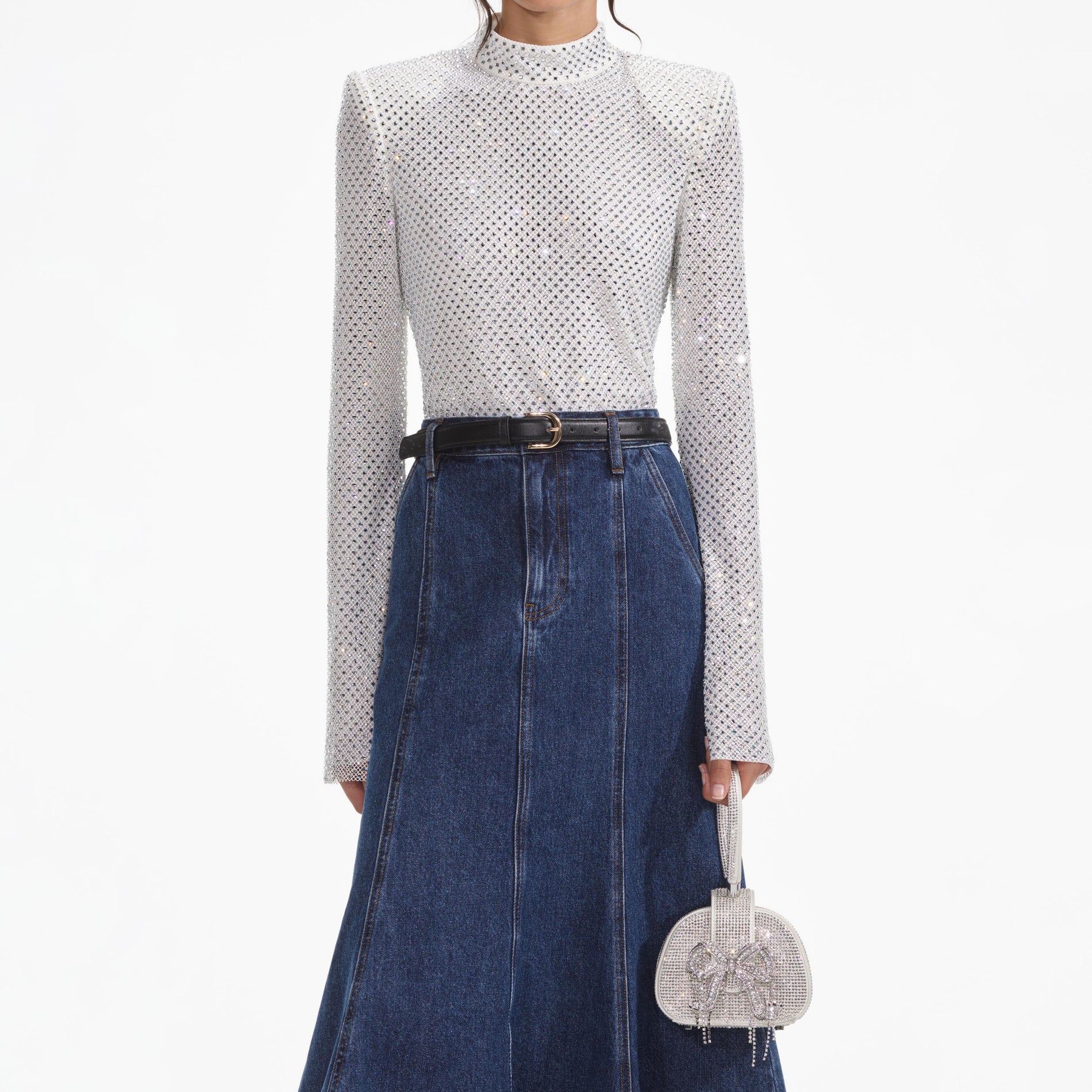 A close up of a woman wearing the Silver Rhinestone Fishnet Top