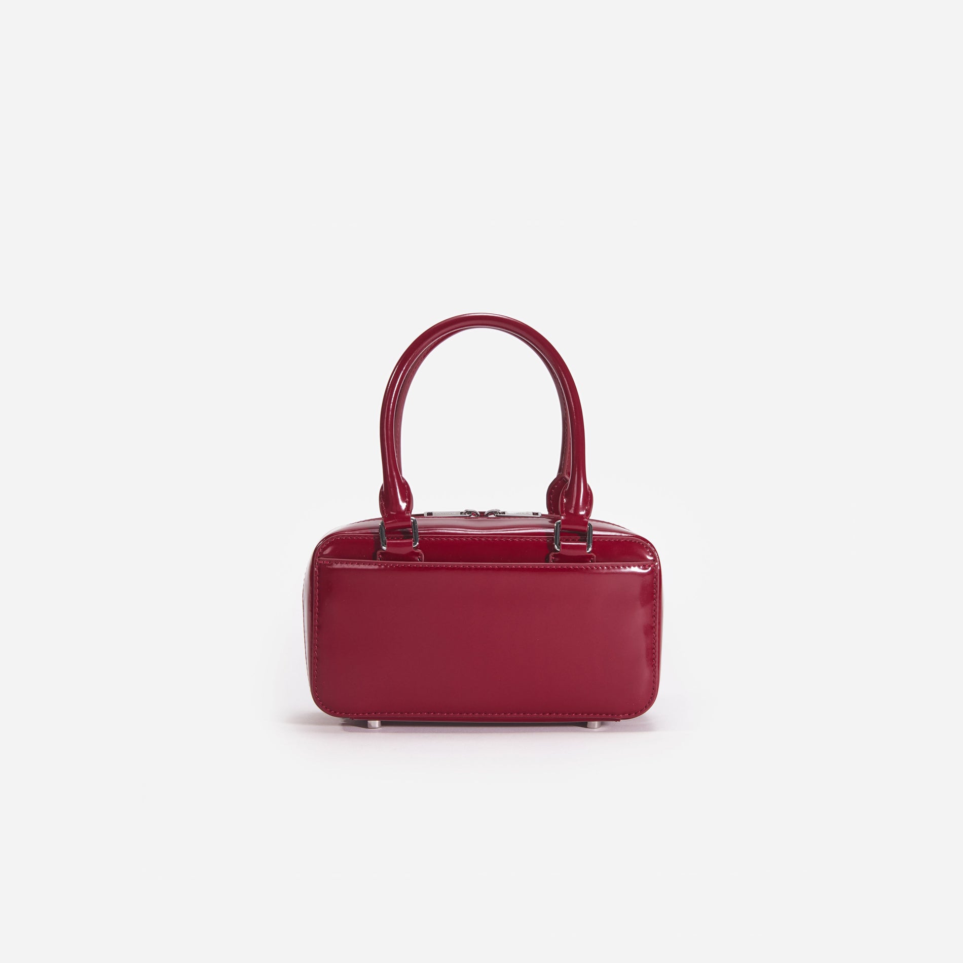 Back view of a woman wearing the White Burgundy Leather Mini Tote Bag