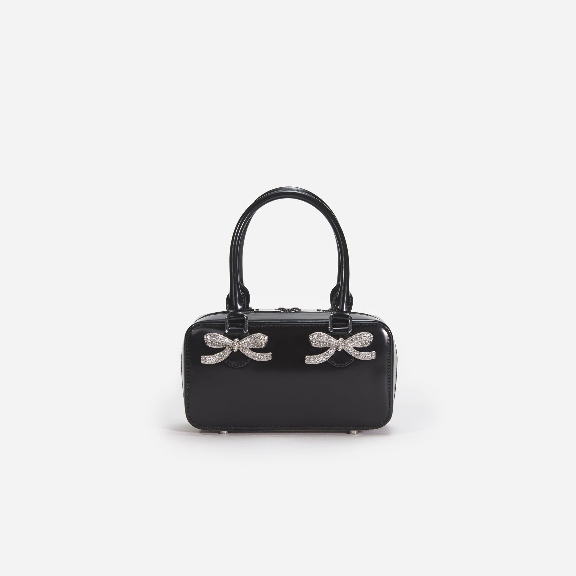 Front view of a woman wearing the Black Leather Mini Tote Bag