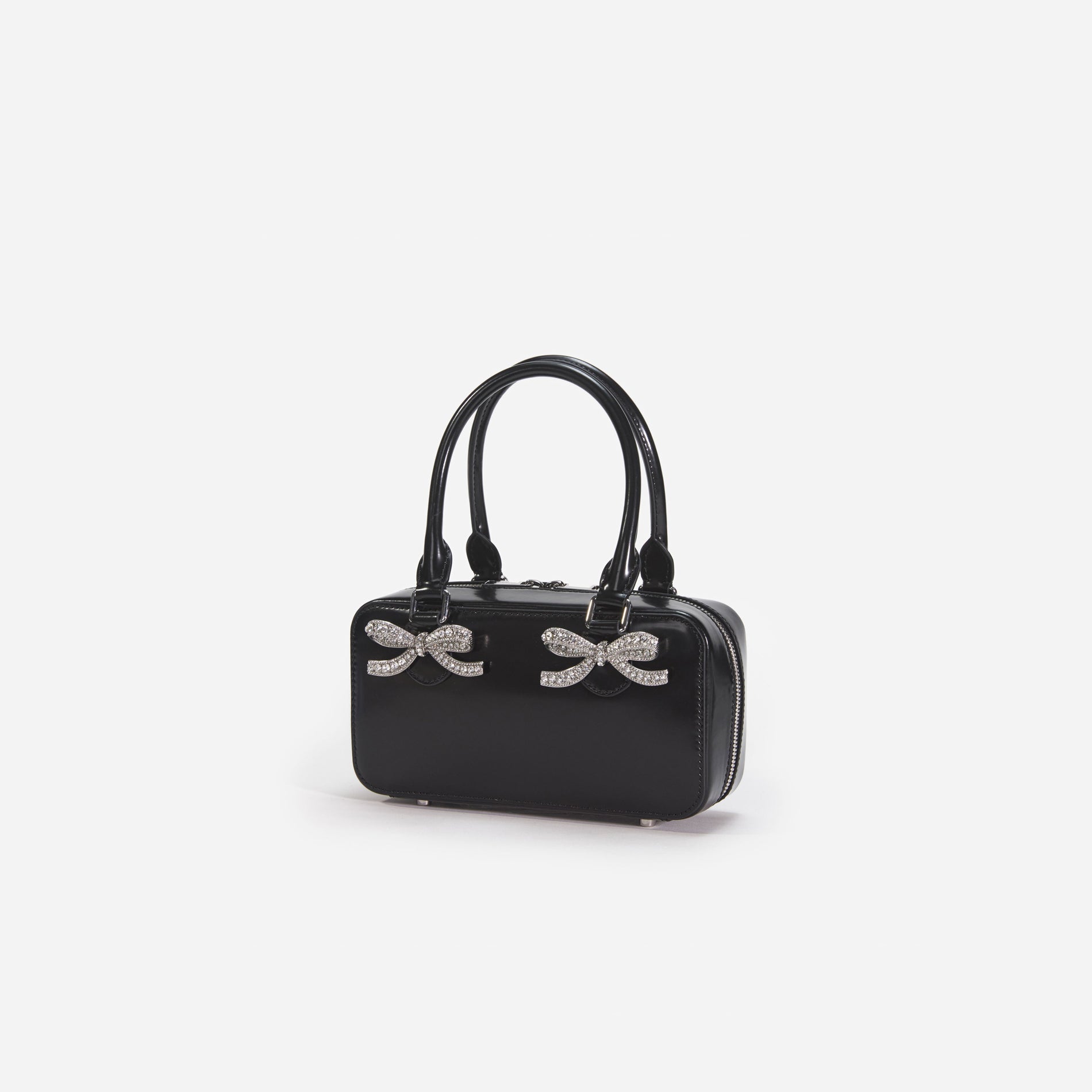 Side view of a woman wearing the Black Leather Mini Tote Bag